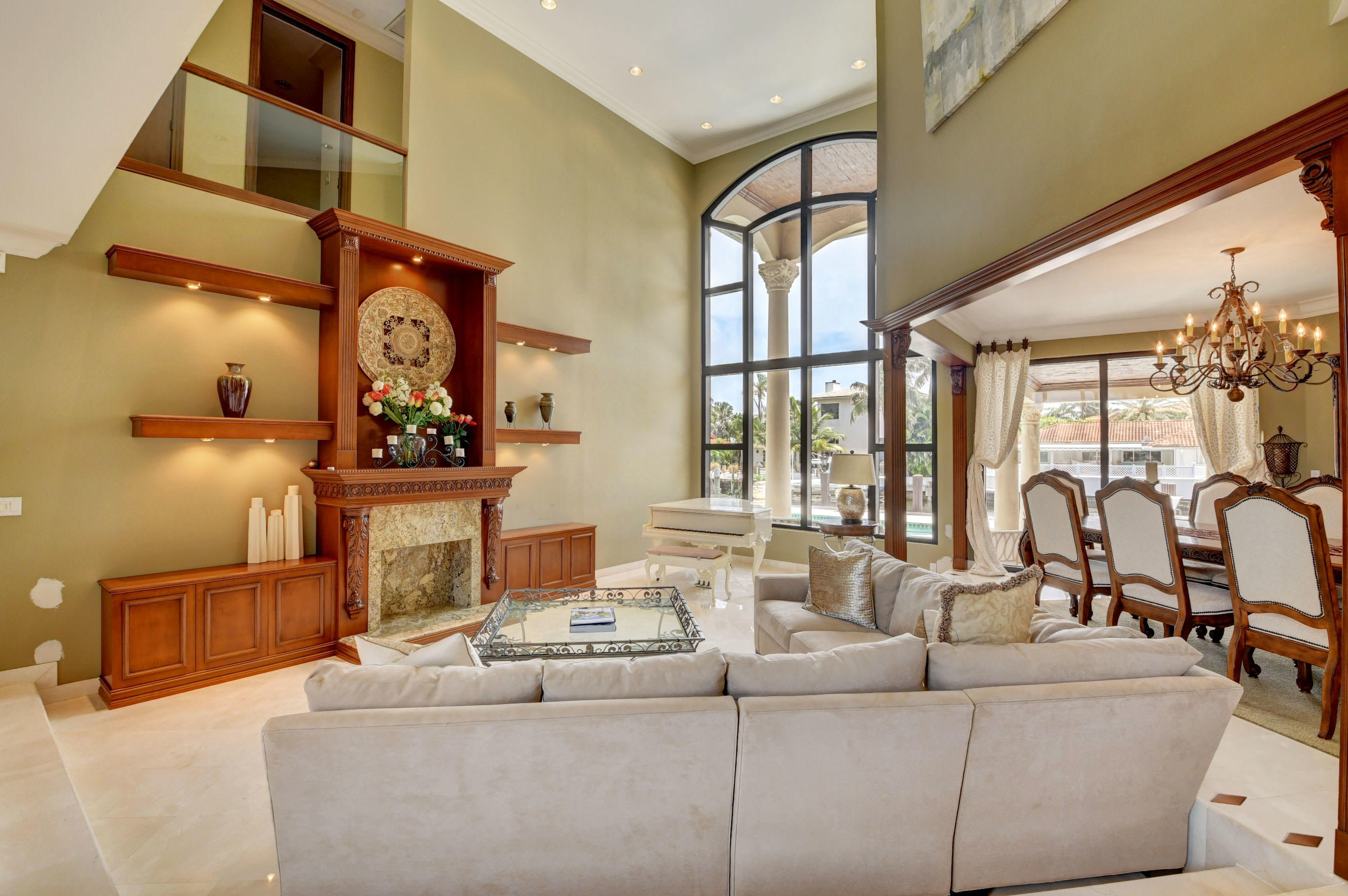 860 Northeast 79th Street Boca Raton, FL 33487 - Photo 17 of 109 a living room with fireplace furniture and a floor to ceiling window