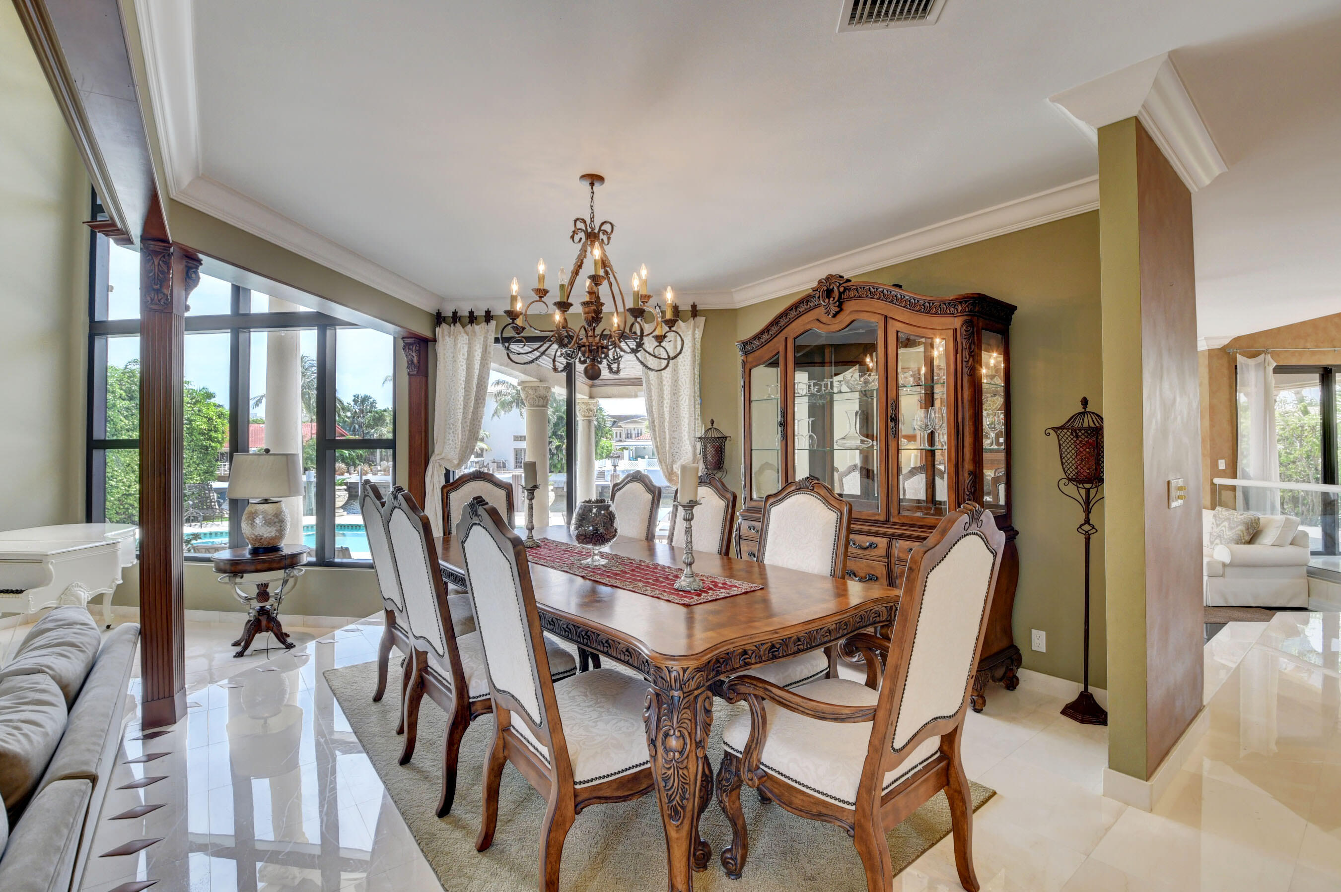 860 Northeast 79th Street Boca Raton, FL 33487 - Photo 18 of 109 a view of a dining room with furniture a chandelier and wooden floor