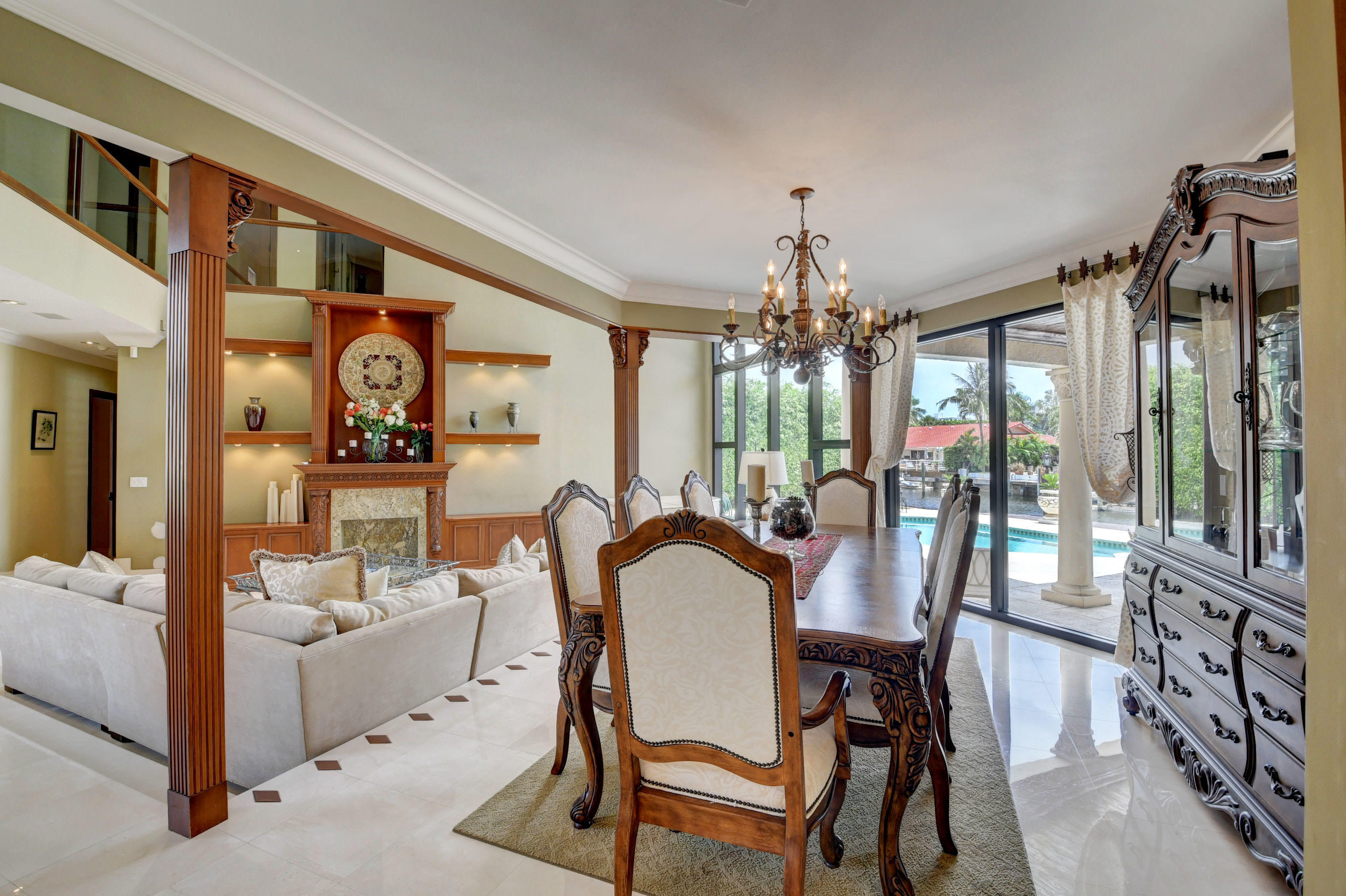 860 Northeast 79th Street Boca Raton, FL 33487 - Photo 19 of 109 a view of a dining room with furniture and a chandelier