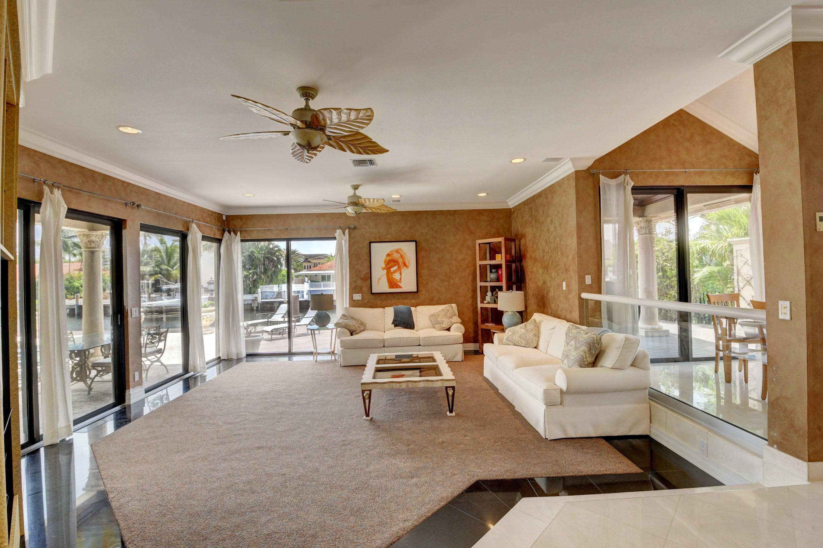 860 Northeast 79th Street Boca Raton, FL 33487 - Photo 25 of 109 a living room with furniture large window and flat screen tv