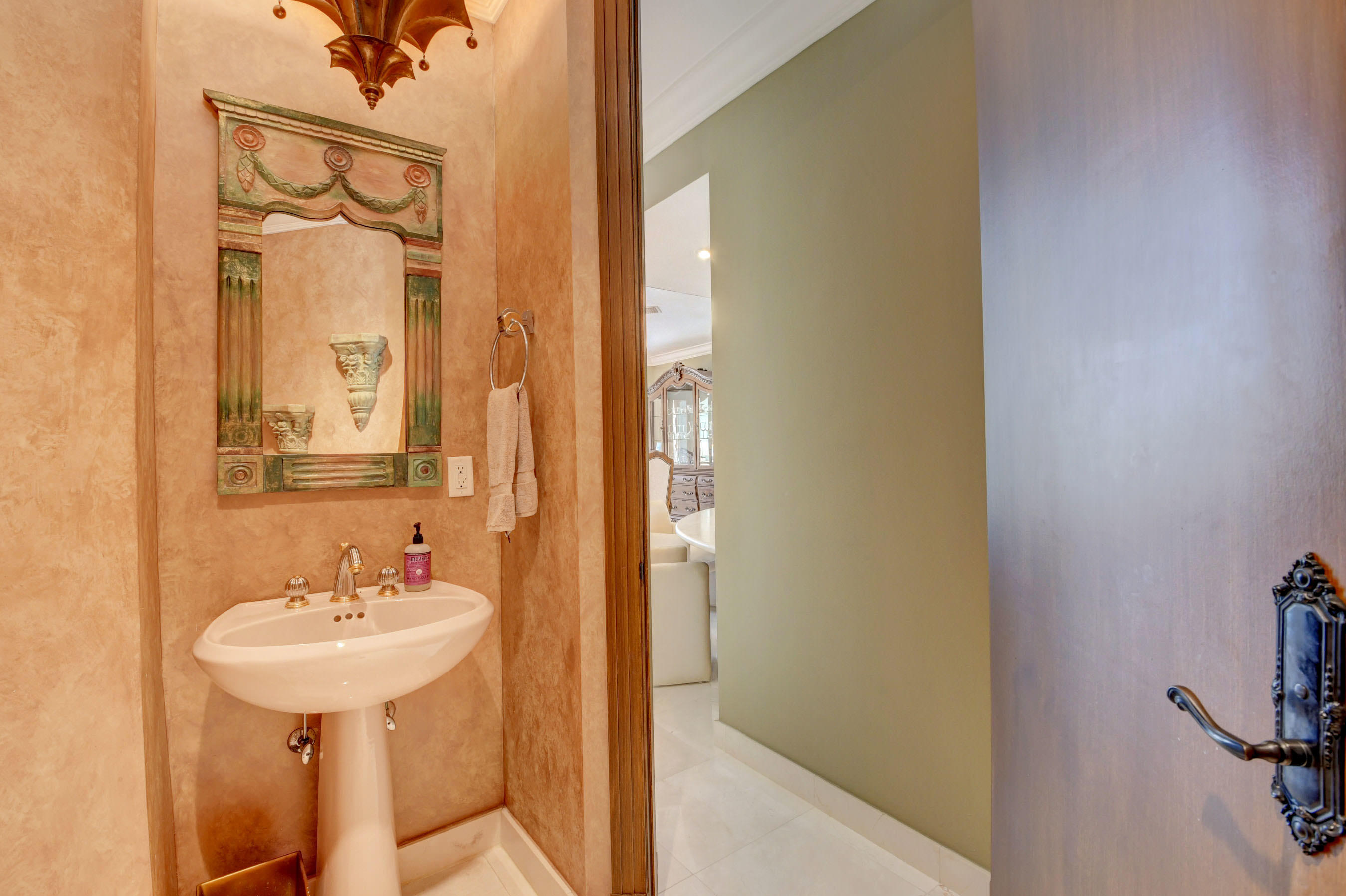 860 Northeast 79th Street Boca Raton, FL 33487 - Photo 34 of 109 a bathroom with a sink a mirror and a shower
