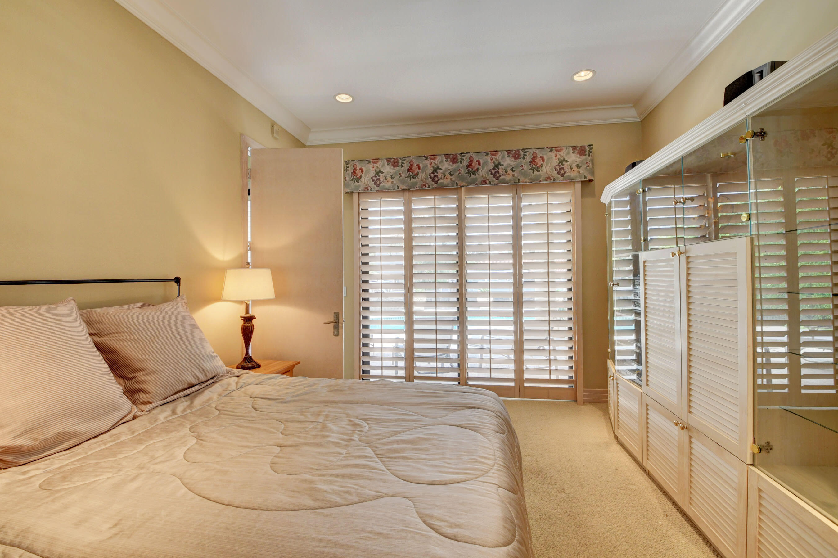 860 Northeast 79th Street Boca Raton, FL 33487 - Photo 37 of 109 a bedroom with a large bed and a large window