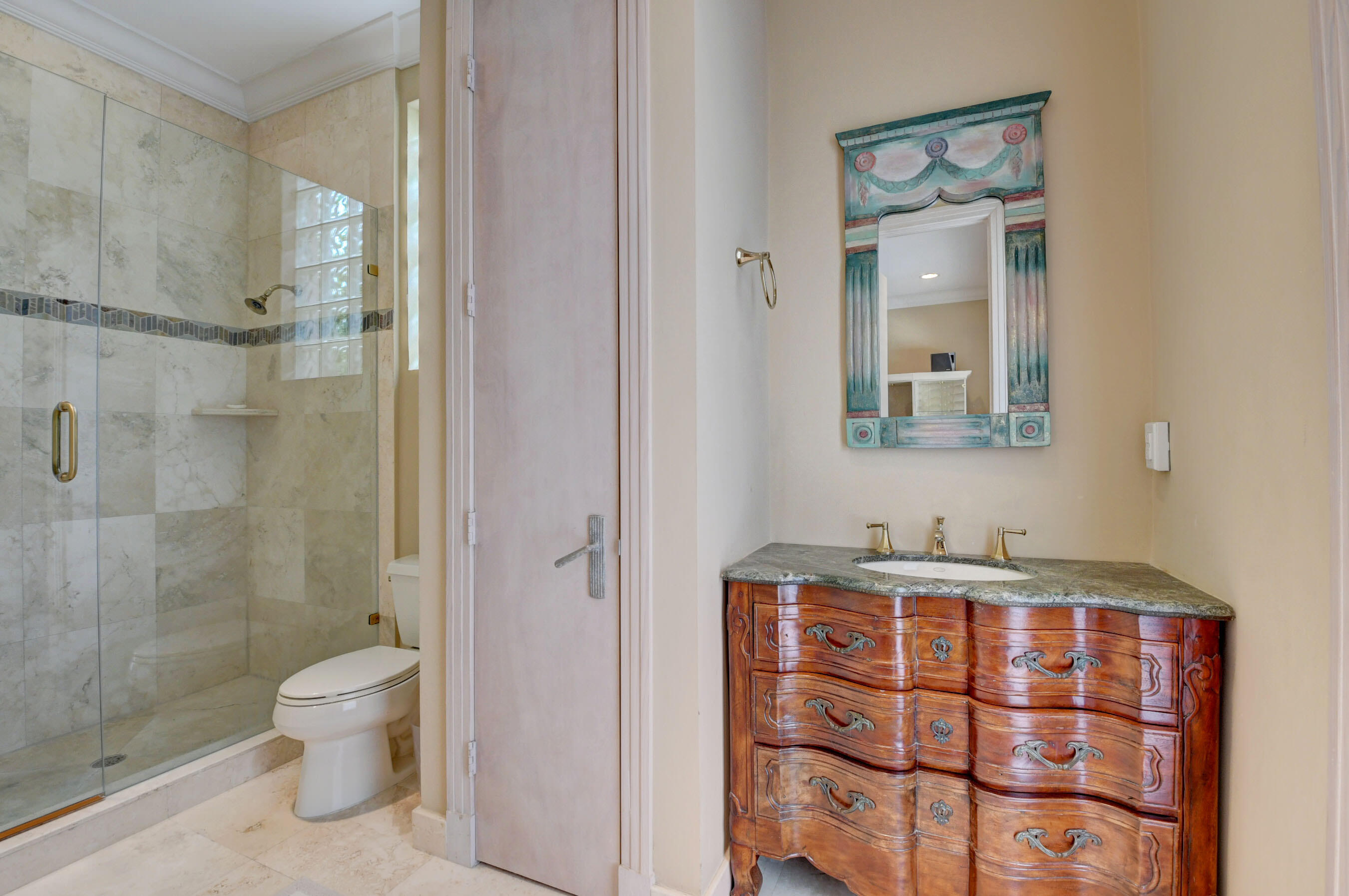 860 Northeast 79th Street Boca Raton, FL 33487 - Photo 39 of 109 a bathroom with a granite countertop sink a toilet and shower