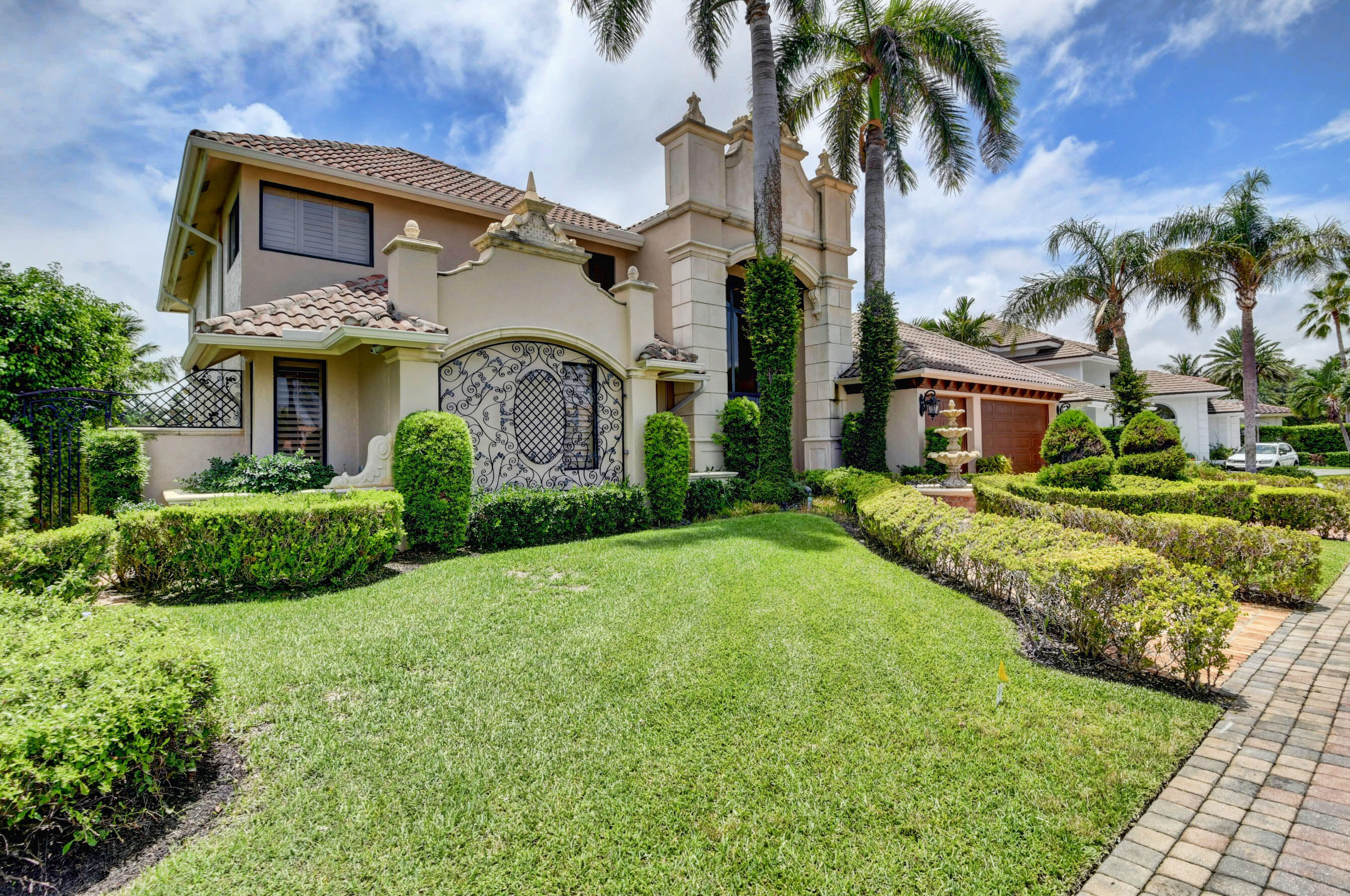 860 Northeast 79th Street Boca Raton, FL 33487 - Photo 4 of 109 a view of a white house with a big yard and potted plants