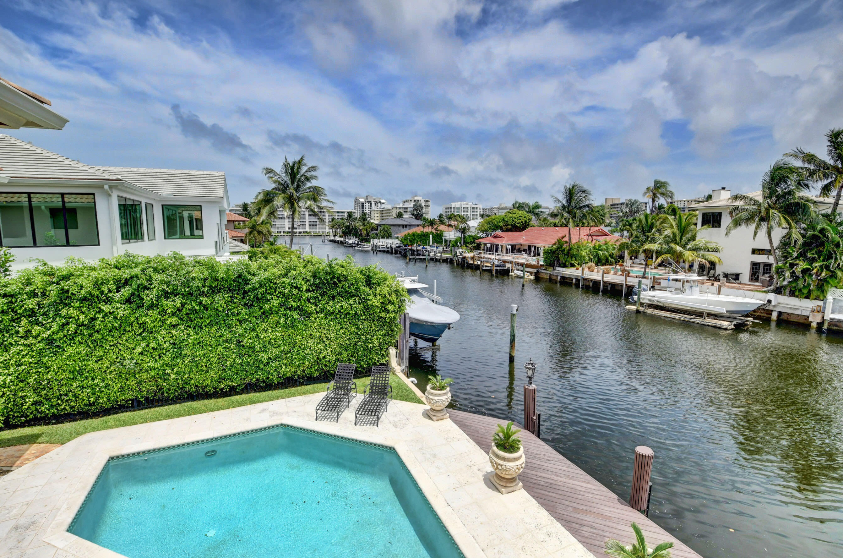 860 Northeast 79th Street Boca Raton, FL 33487 - Photo 58 of 109 a view of a lake with a house in the background