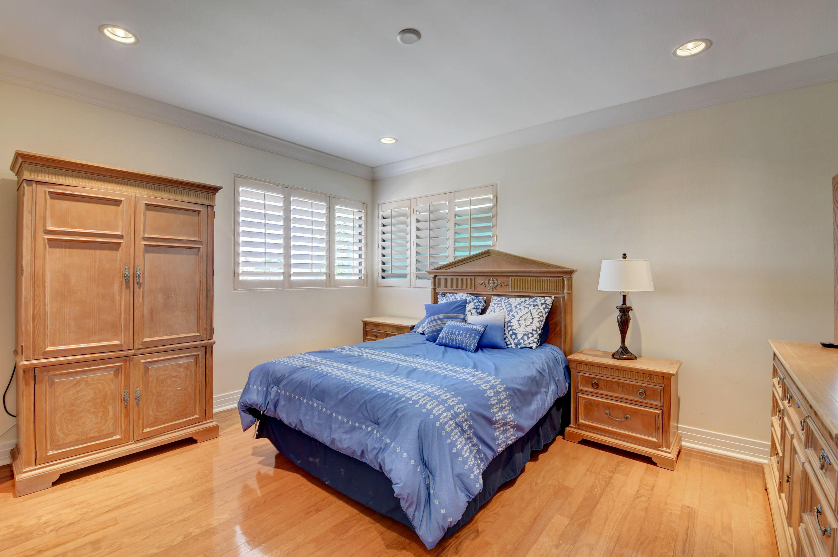 860 Northeast 79th Street Boca Raton, FL 33487 - Photo 61 of 109 a bedroom with a bed and wooden floor