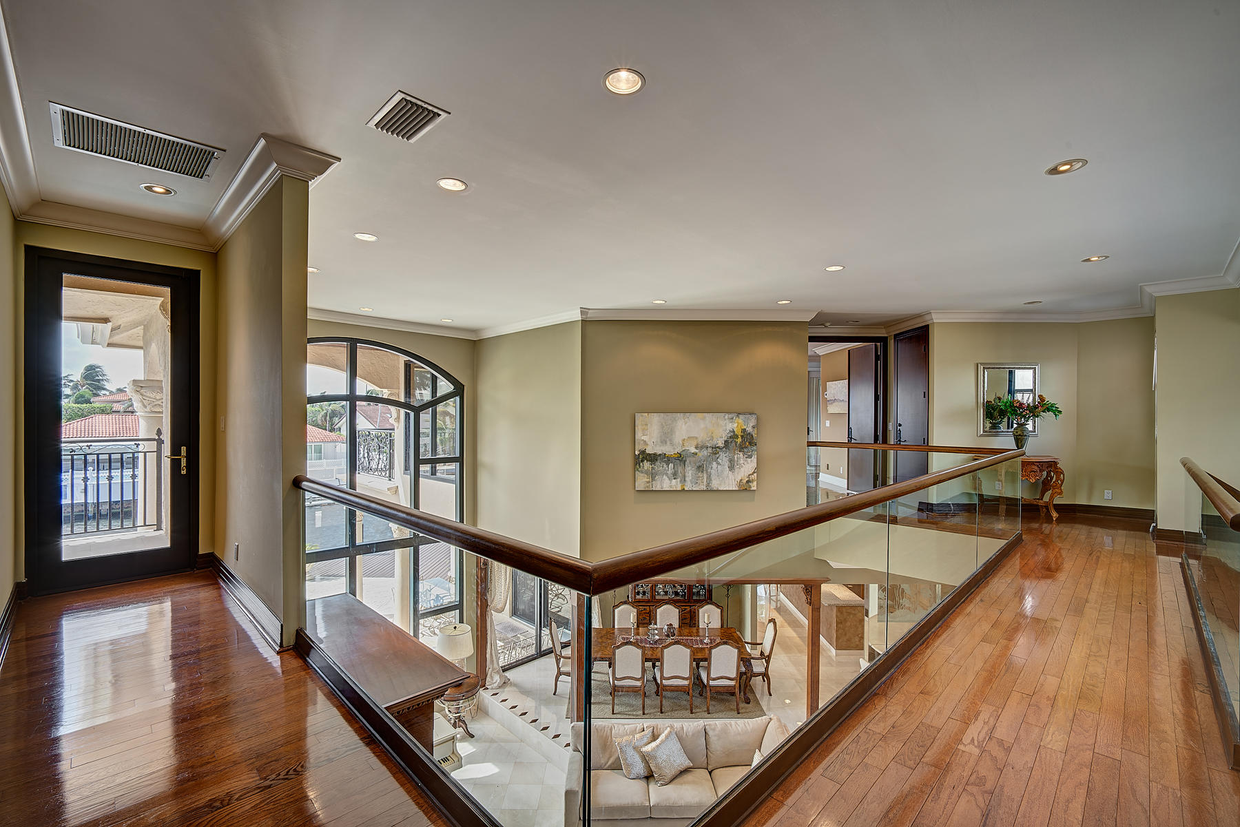 860 Northeast 79th Street Boca Raton, FL 33487 - Photo 68 of 109 a view of a hallway with wooden floor and stairs