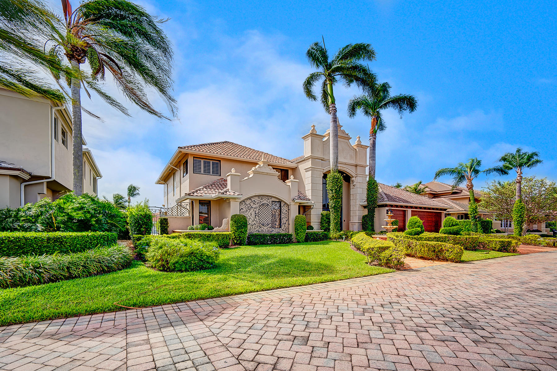 860 Northeast 79th Street Boca Raton, FL 33487 - Photo 82 of 109 a front view of a house with a yard and potted plants