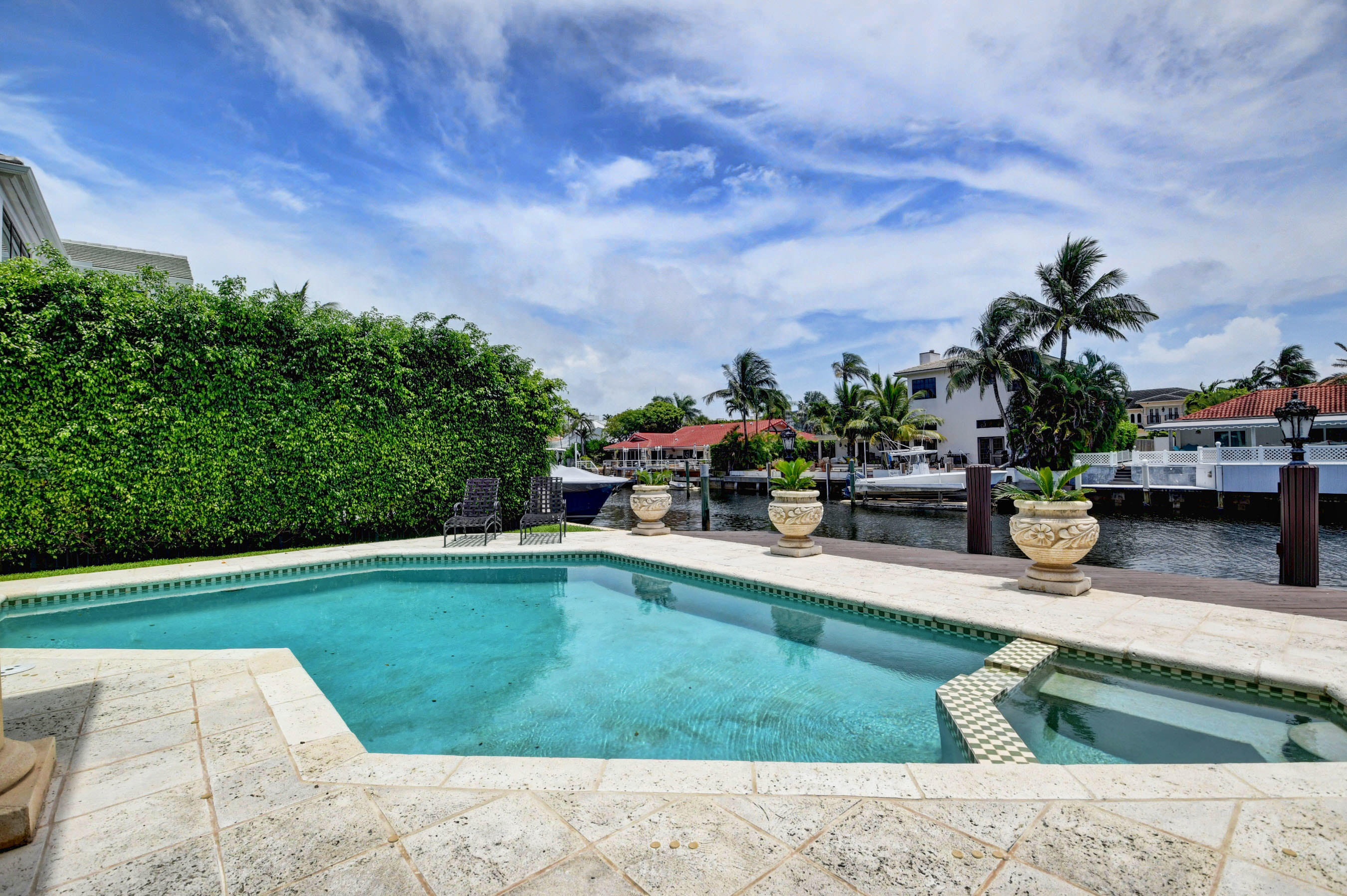 860 Northeast 79th Street Boca Raton, FL 33487 - Photo 97 of 109 a swimming pool with outdoor seating and garden