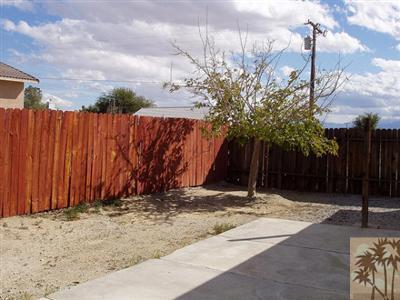 66011 Santa Rosa Road Desert Hot Springs, CA 92240 - Photo 2 of 3 a view of wooden fence under a large tree