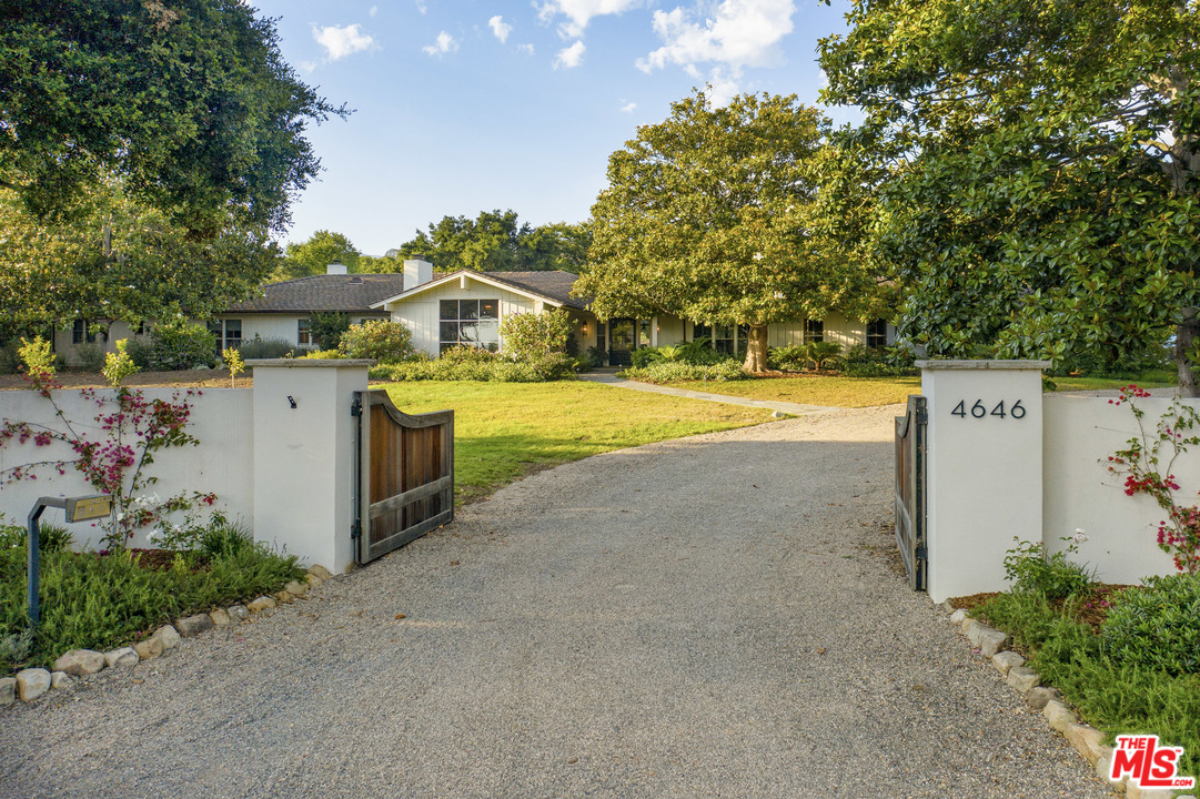 4646 Via Roblada Santa Barbara, CA 93110 - Photo 2 of 36 a view of a house with a yard and a large tree