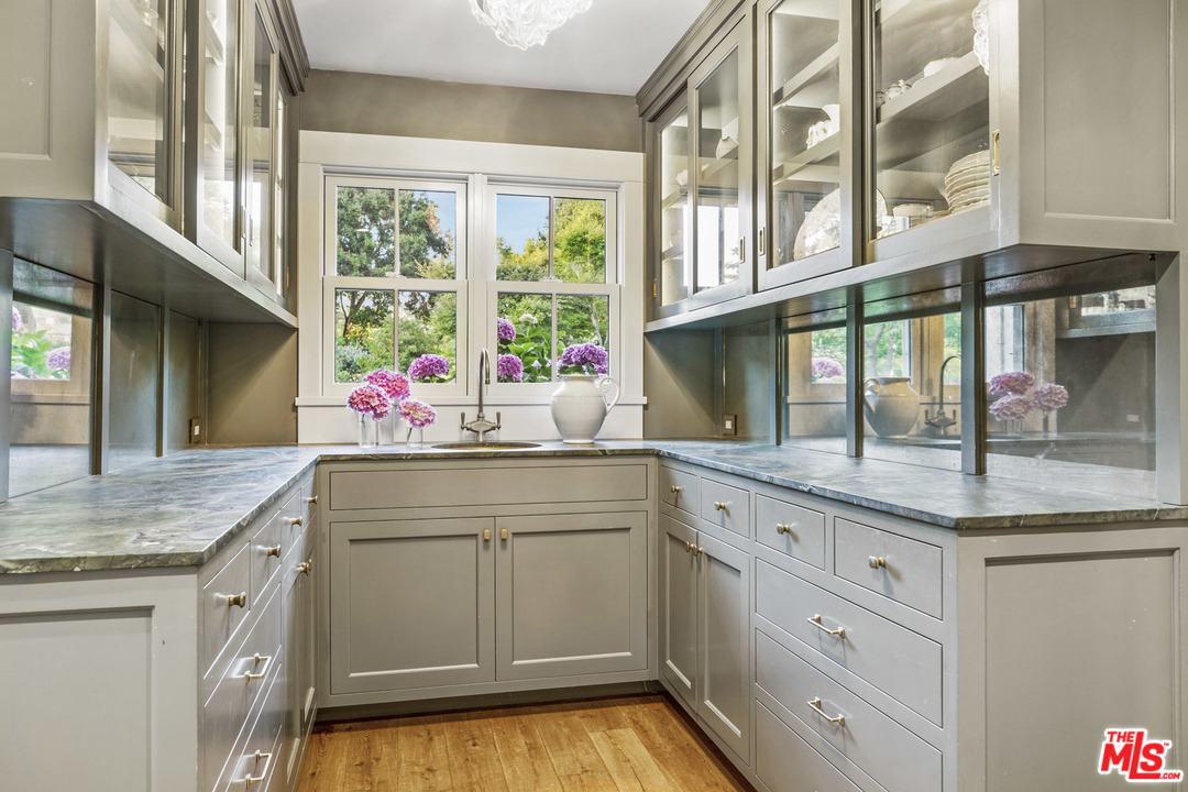 4646 Via Roblada Santa Barbara, CA 93110 - Photo 15 of 36 a kitchen with granite countertop a sink and cabinets