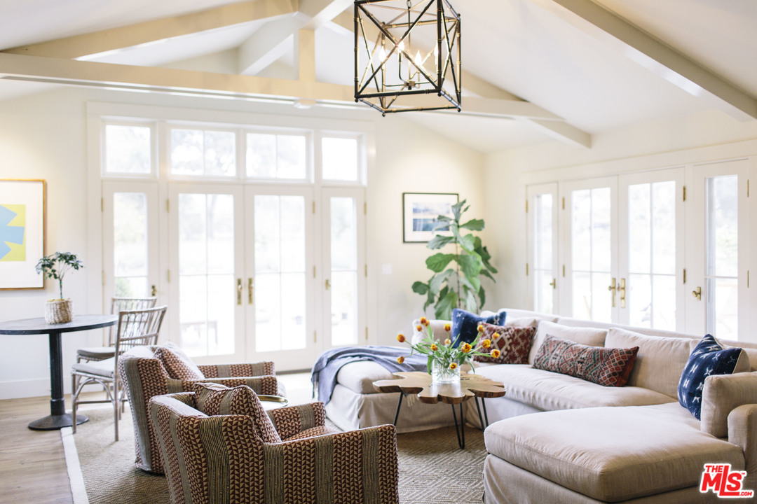 4646 Via Roblada Santa Barbara, CA 93110 - Photo 17 of 36 a living room with furniture and floor to ceiling windows