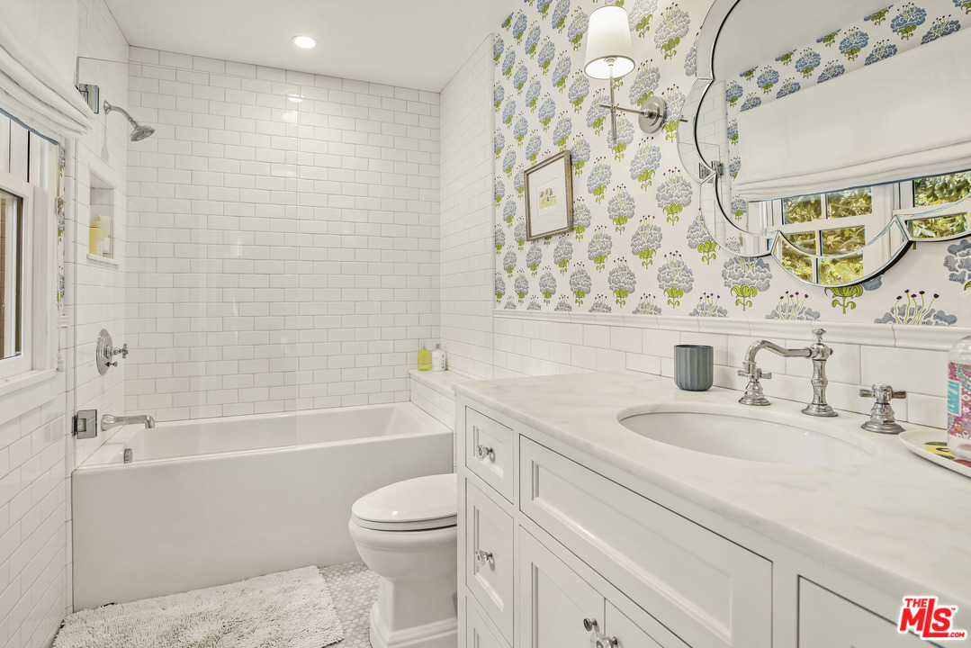 4646 Via Roblada Santa Barbara, CA 93110 - Photo 32 of 36 a bathroom with a sink a toilet and a bathtub