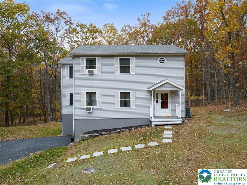 a house with trees in the background