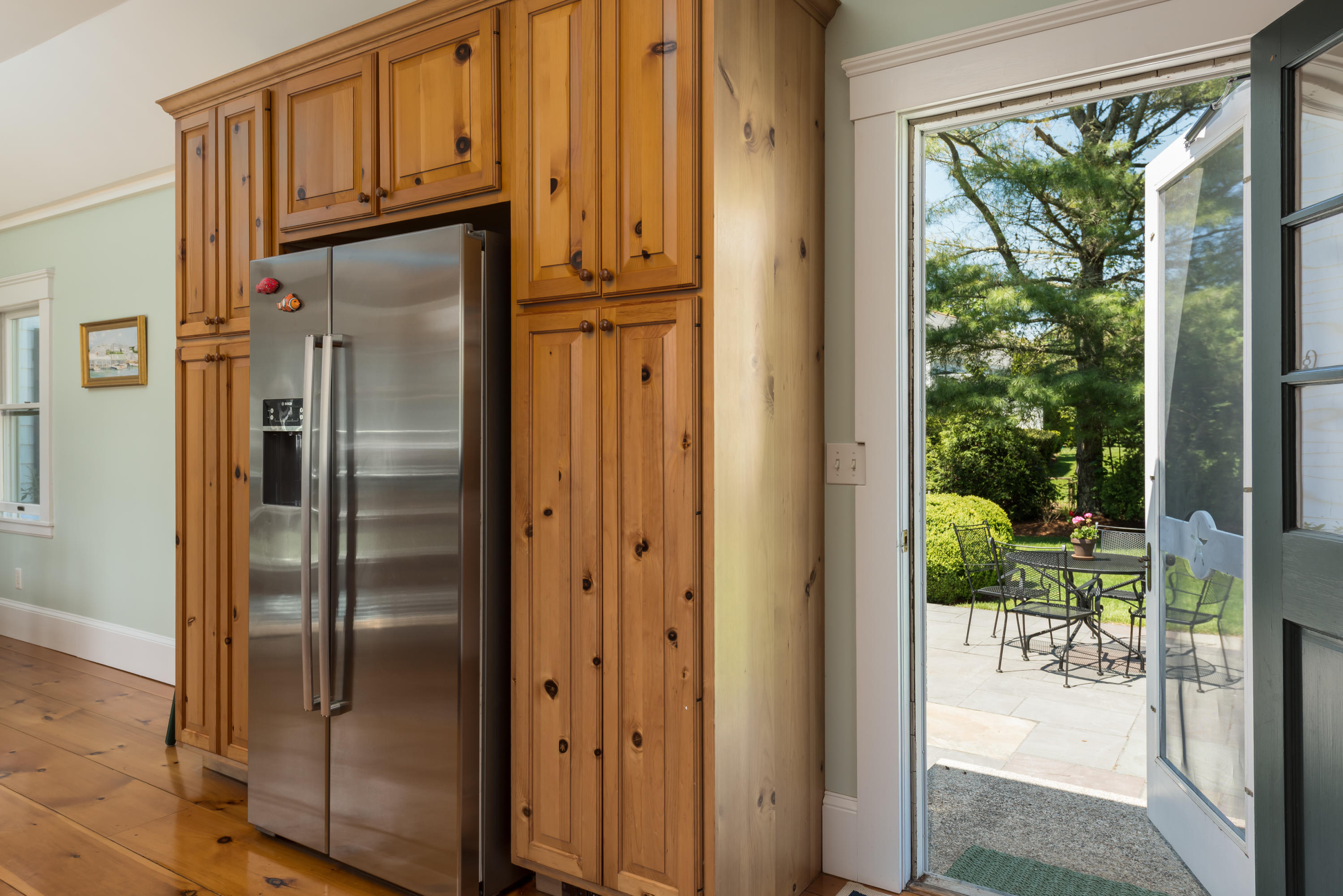 8 Gorham Road Harwich, MA 02645 - Photo 11 of 33 a kitchen with stainless steel appliances granite countertop a refrigerator and mountain view