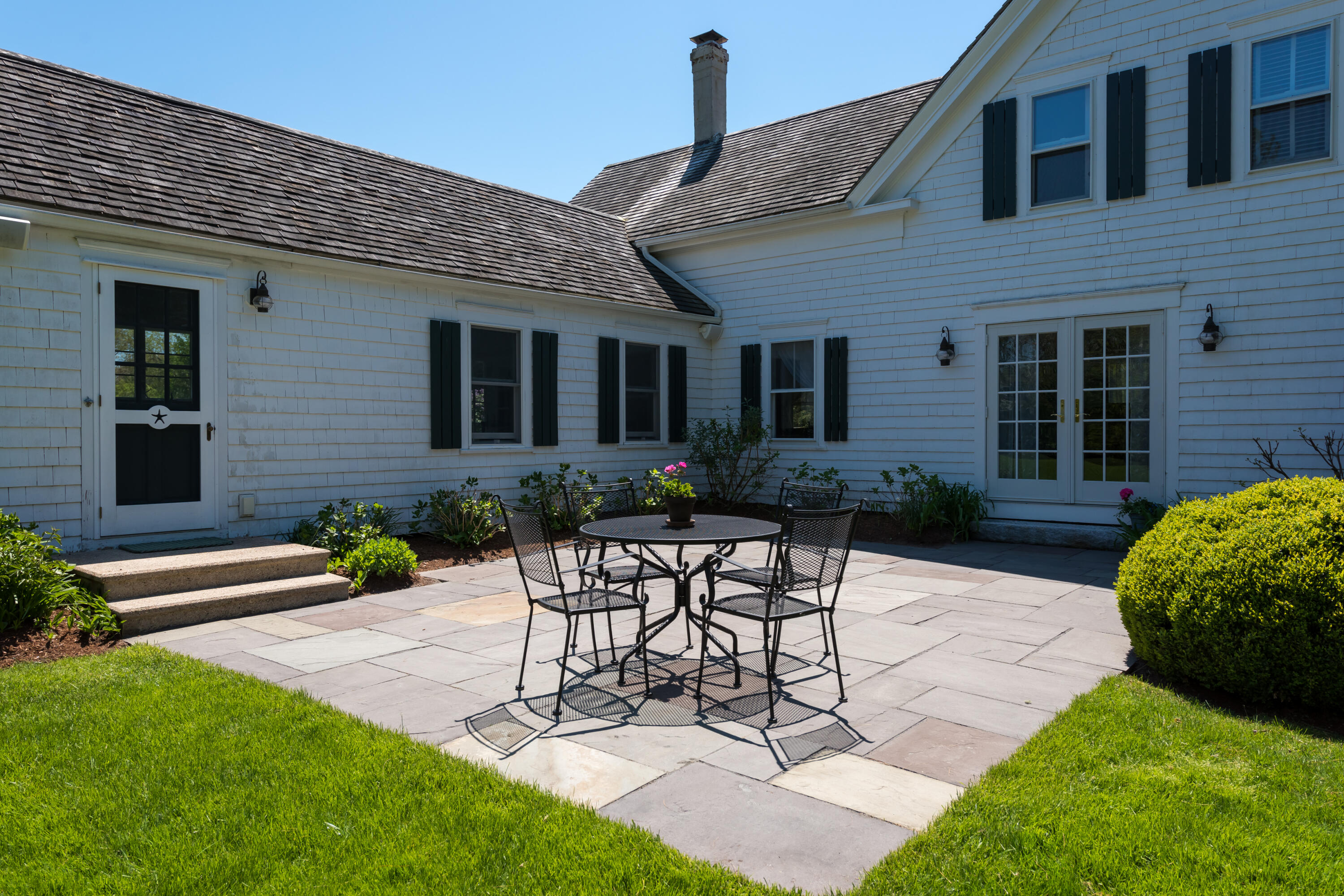 8 Gorham Road Harwich, MA 02645 - Photo 12 of 33 a view of a house with patio and a yard