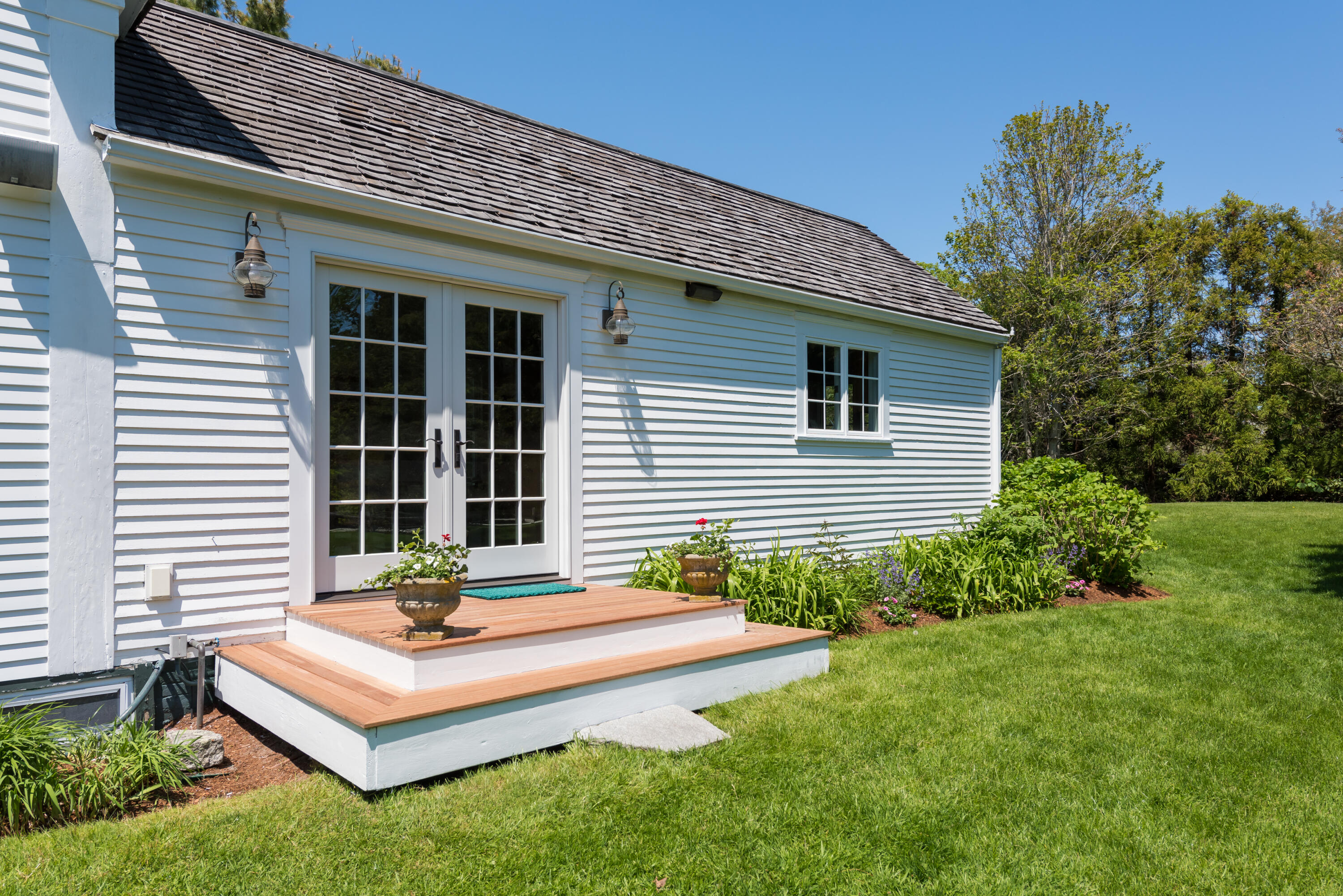 8 Gorham Road Harwich, MA 02645 - Photo 14 of 33 a front view of a house with a yard