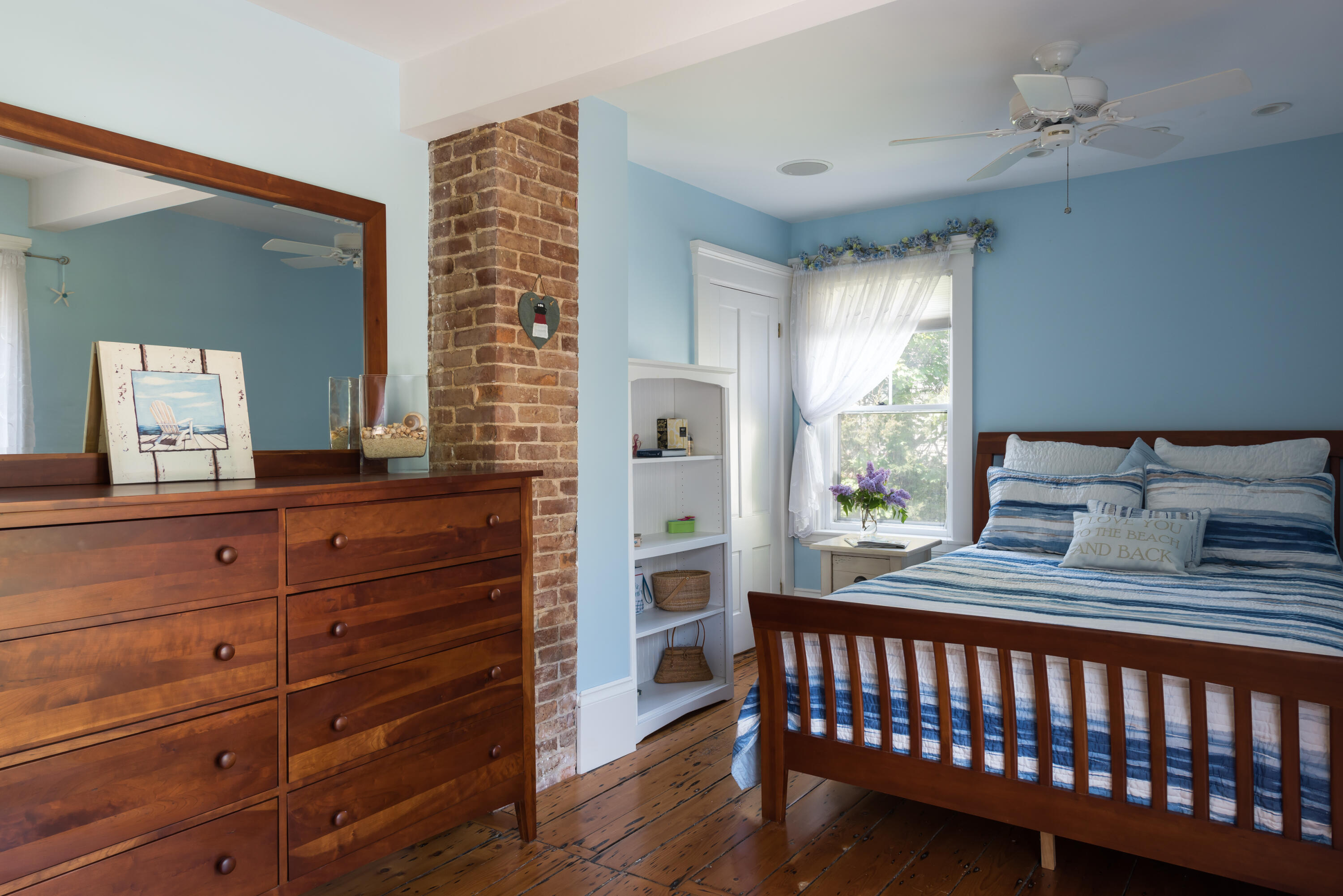 8 Gorham Road Harwich, MA 02645 - Photo 16 of 33 a bedroom with a bed and wooden floor