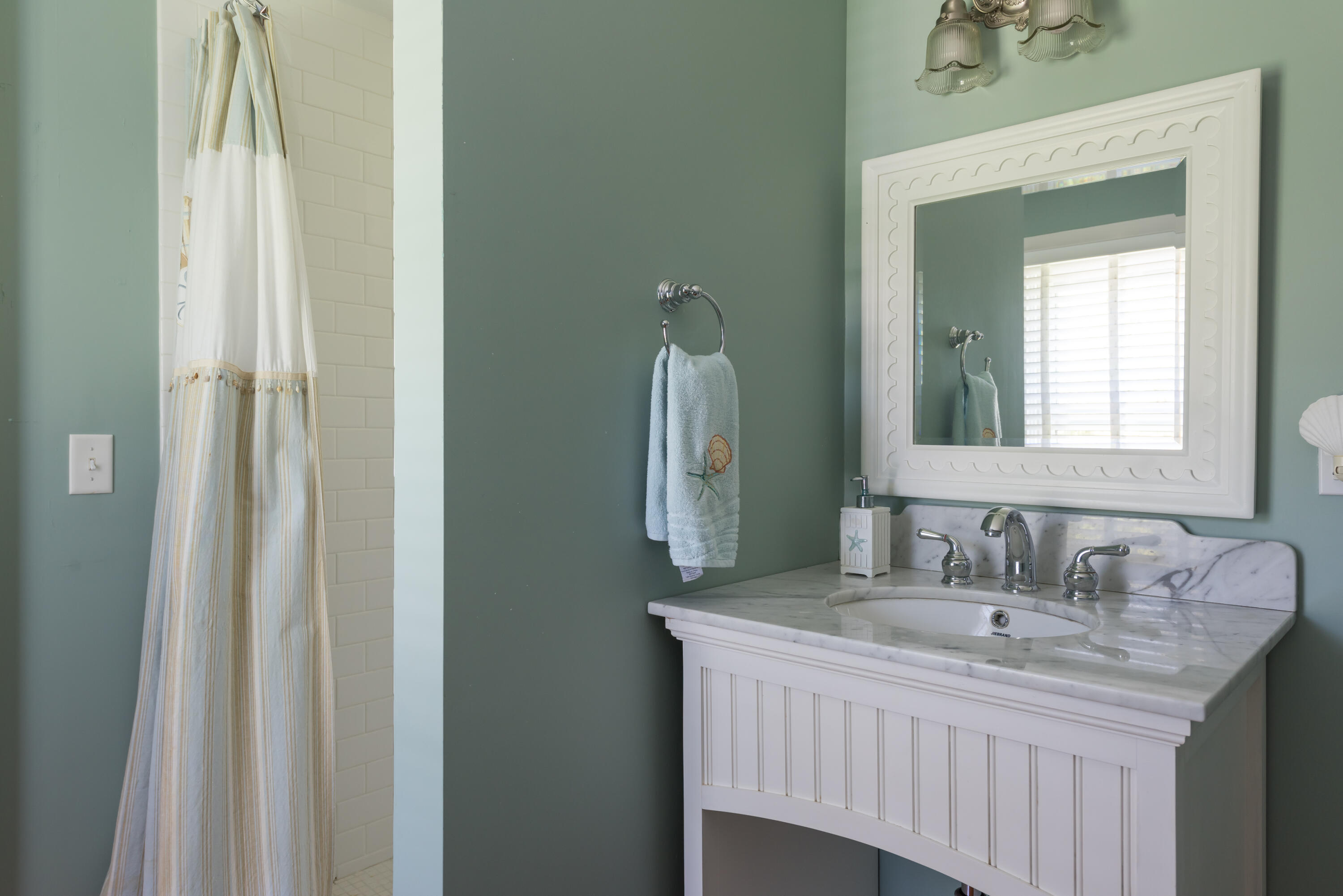 8 Gorham Road Harwich, MA 02645 - Photo 18 of 33 a bathroom with a sink and a mirror