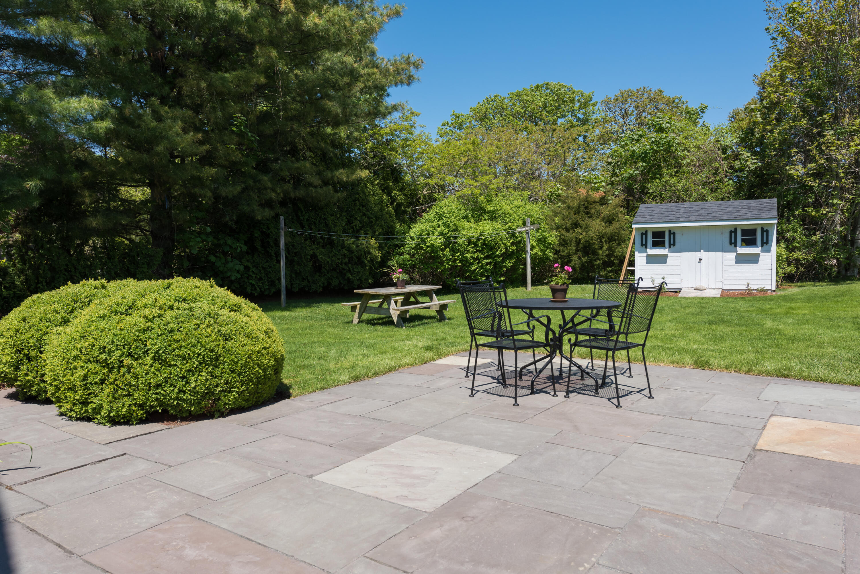 8 Gorham Road Harwich, MA 02645 - Photo 23 of 33 a view of a bench in a backyard