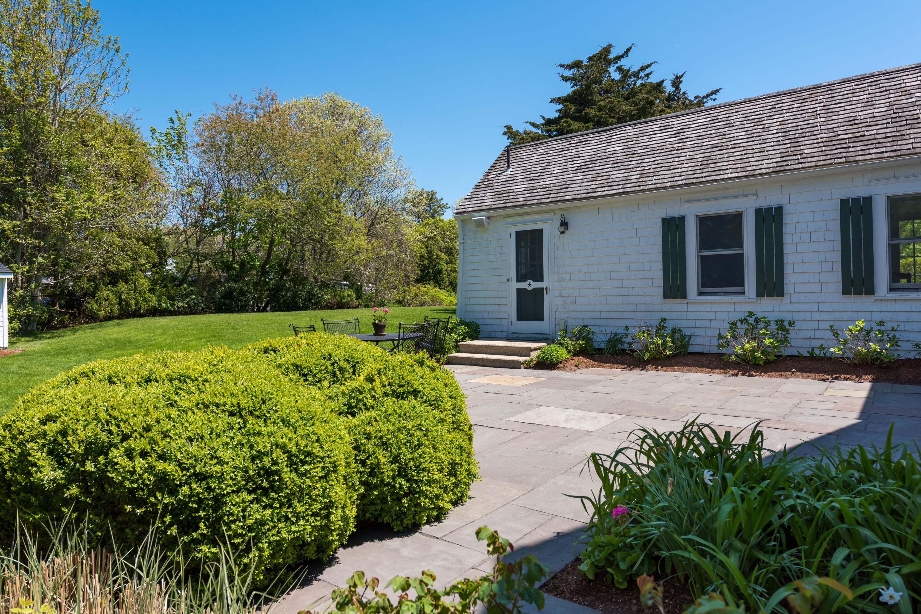 8 Gorham Road Harwich, MA 02645 - Photo 24 of 33 a front view of a house with a yard