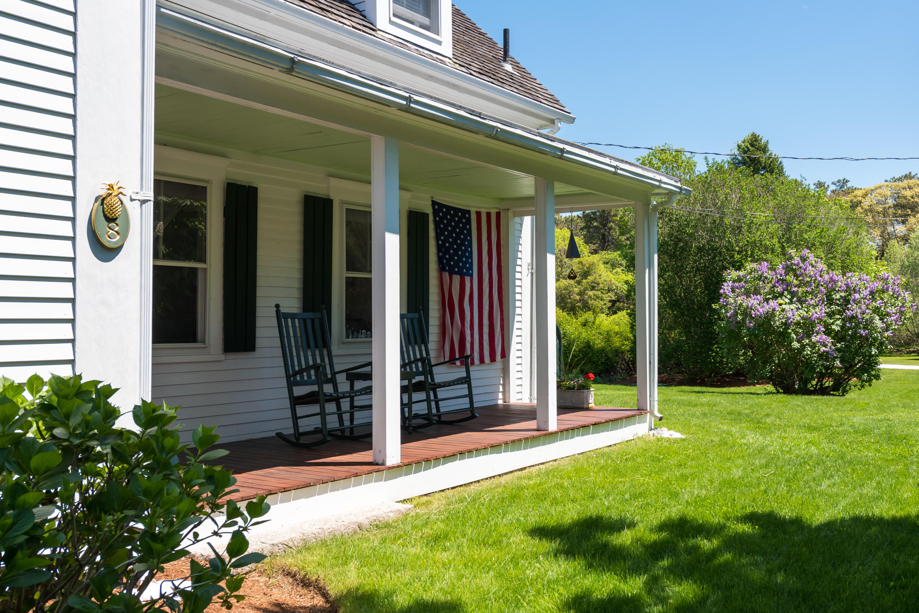 8 Gorham Road Harwich, MA 02645 - Photo 3 of 33 a front view of a house with a garden
