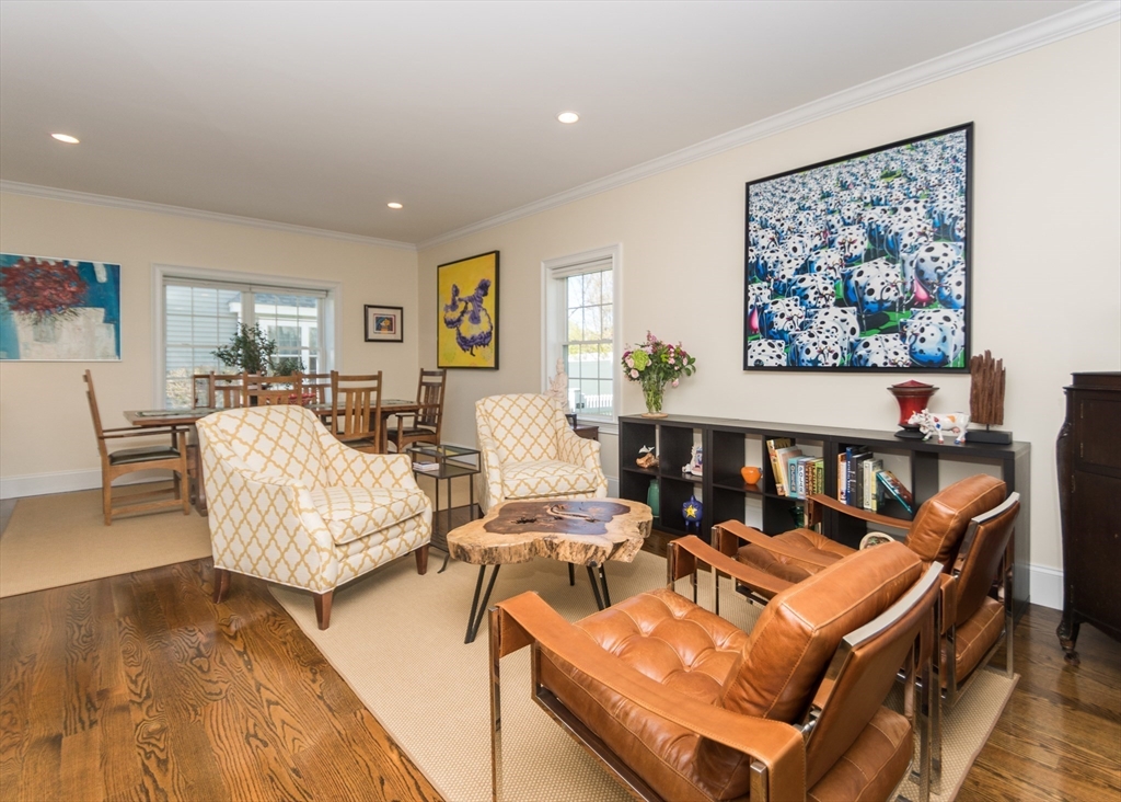 128 Church Street, Unit 2 Waltham, MA 02452 - Photo 7 of 41 a living room with fireplace furniture and a wooden floor