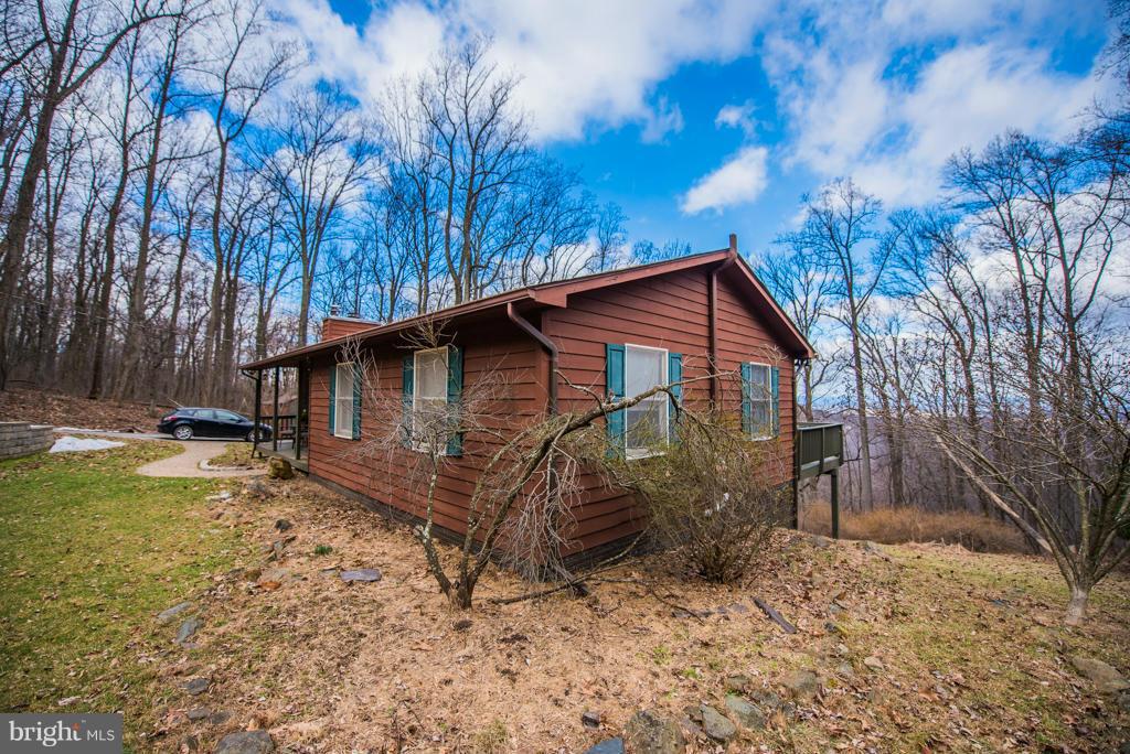 3 Blue Sky Road Linden, VA 22642 - Photo 2 of 30 a view of a house with a yard covered in snow