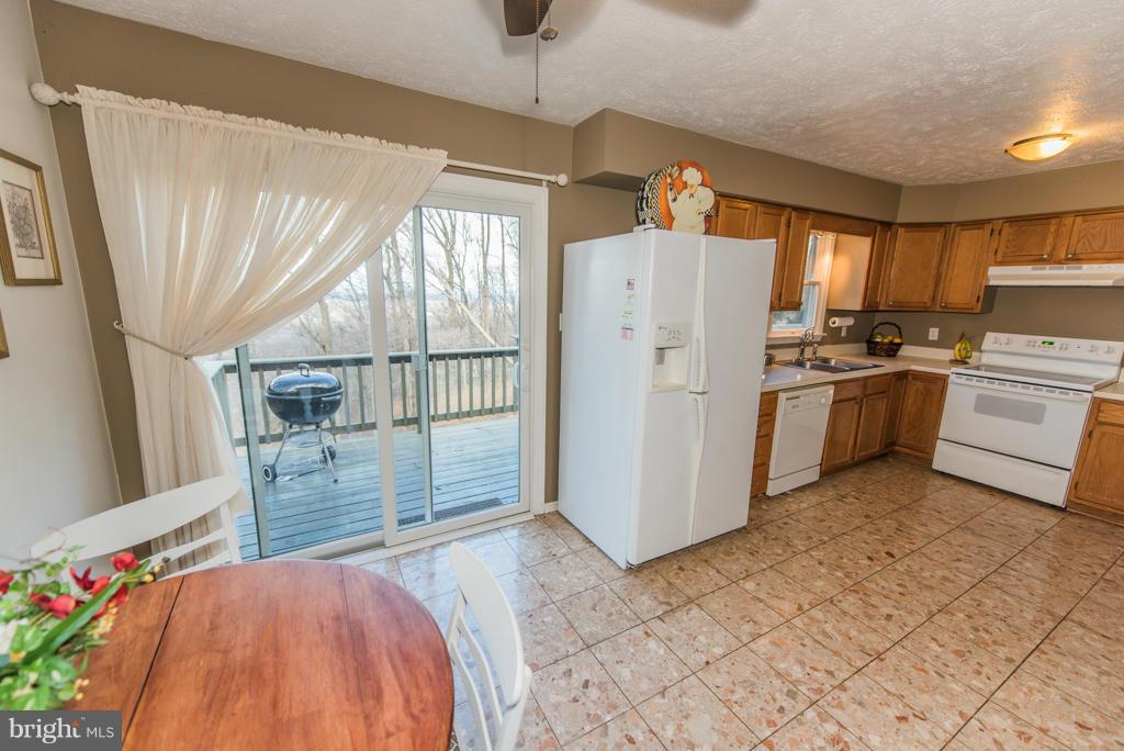 3 Blue Sky Road Linden, VA 22642 - Photo 13 of 30 a kitchen with refrigerator and window