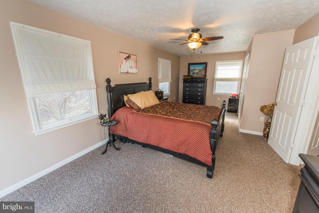3 Blue Sky Road Linden, VA 22642 - Photo 16 of 30 a bed room with a bed and a window