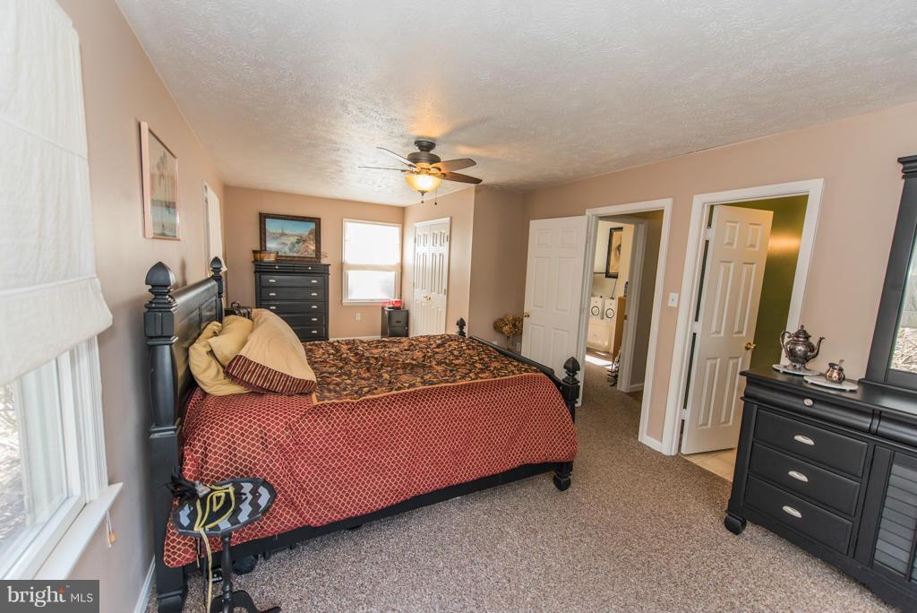 3 Blue Sky Road Linden, VA 22642 - Photo 17 of 30 a bedroom with a bed and a dresser