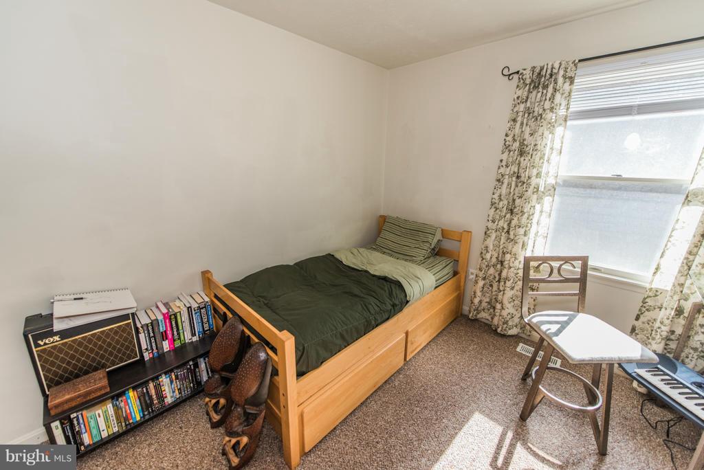 3 Blue Sky Road Linden, VA 22642 - Photo 19 of 30 a bedroom with a bed and a window