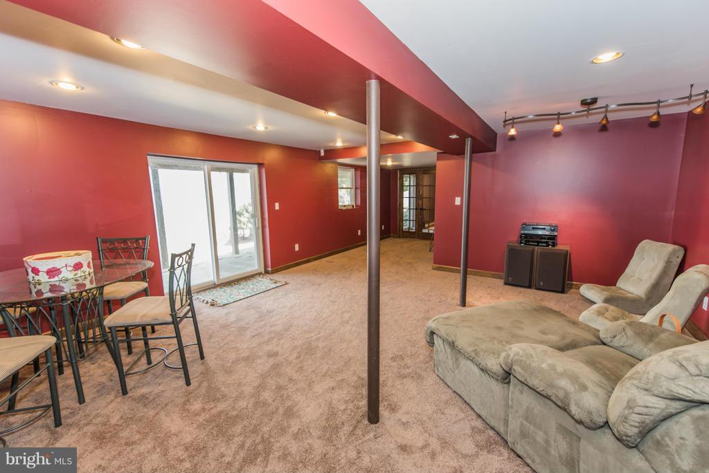 3 Blue Sky Road Linden, VA 22642 - Photo 20 of 30 a bedroom with a bed and a mirror