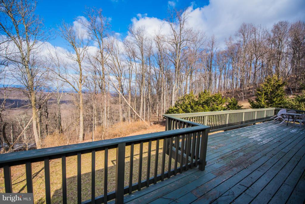 3 Blue Sky Road Linden, VA 22642 - Photo 29 of 30 a view of a porch with furniture and wooden floor