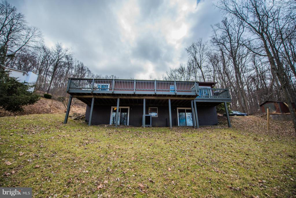 3 Blue Sky Road Linden, VA 22642 - Photo 4 of 30 a view of a house with a wooden fence and a big yard