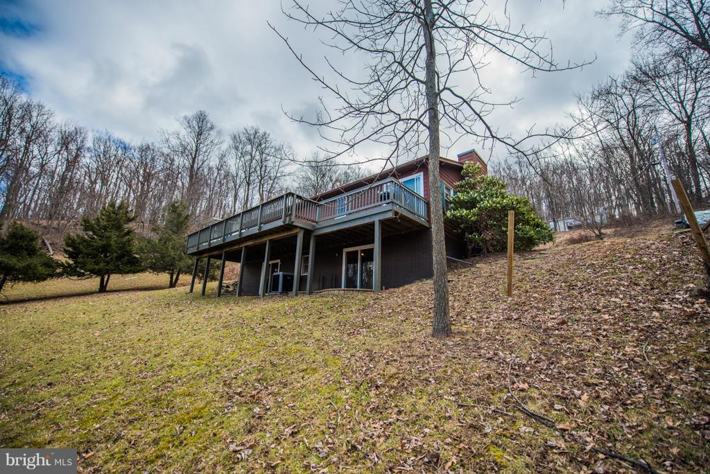 3 Blue Sky Road Linden, VA 22642 - Photo 5 of 30 a front view of house with yard and trees in the background