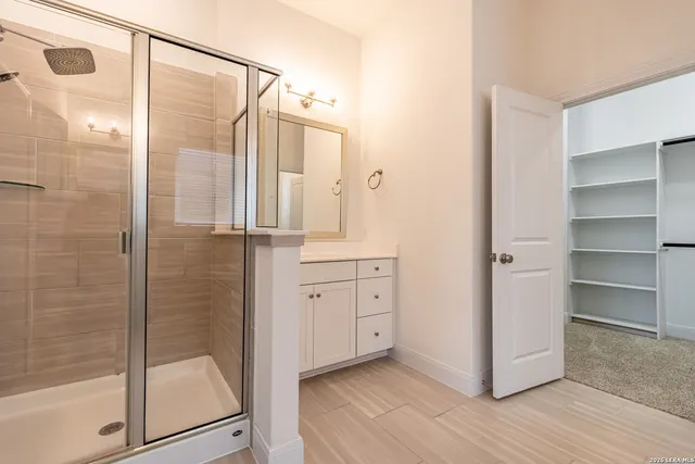a bathroom with a shower and a tub