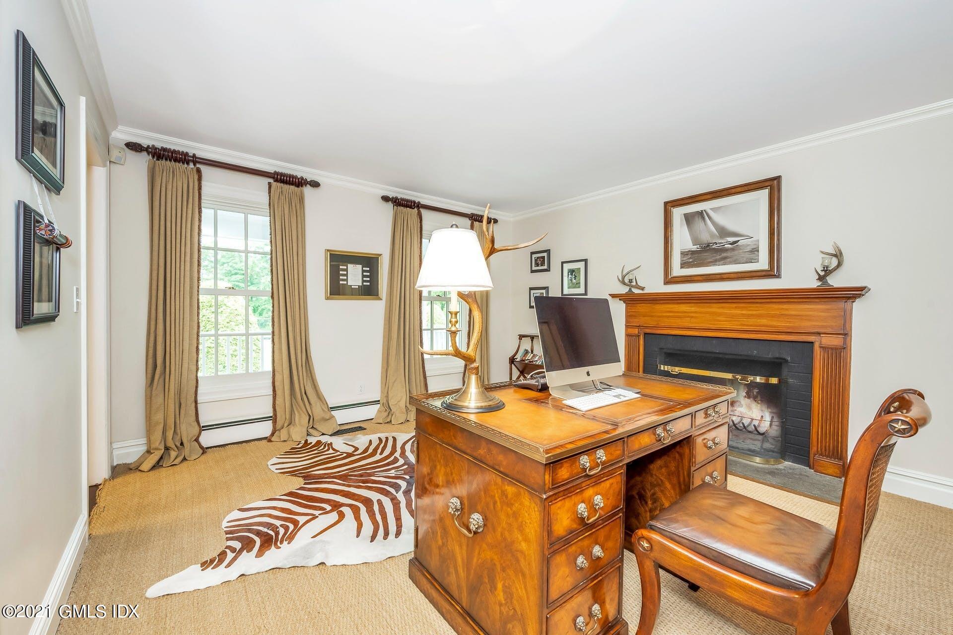 425 Stanwich Road Greenwich, CT 06830 - Photo 12 of 36 a view of a livingroom with furniture and a fireplace