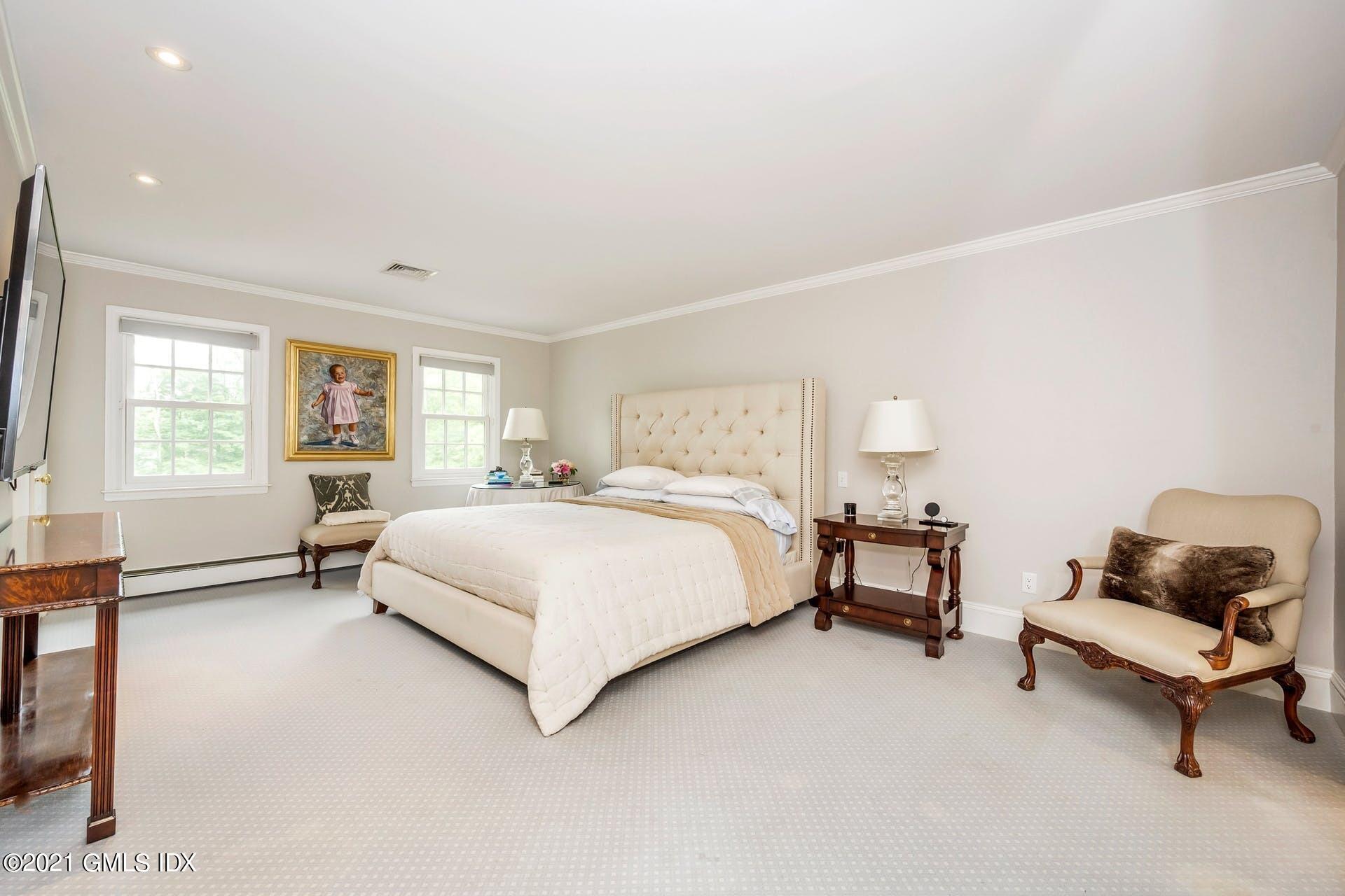 425 Stanwich Road Greenwich, CT 06830 - Photo 13 of 36 a bedroom with a bed chair and window