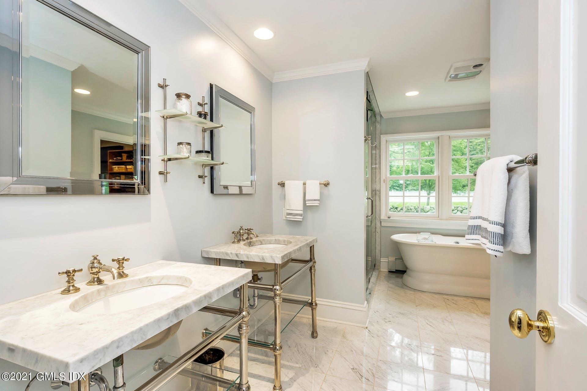 425 Stanwich Road Greenwich, CT 06830 - Photo 14 of 36 a bathroom with a sink vanity tub and shower