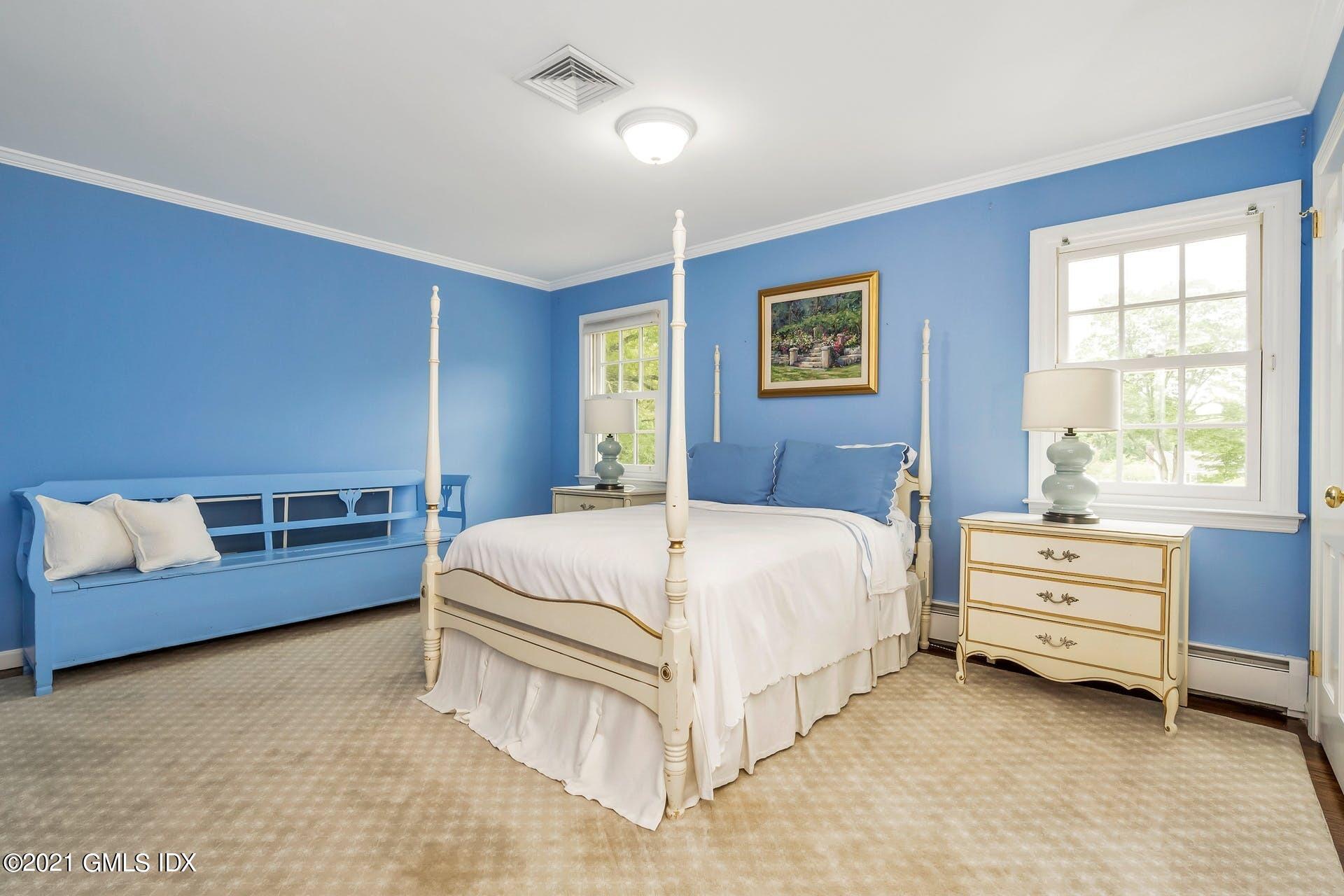 425 Stanwich Road Greenwich, CT 06830 - Photo 17 of 36 a bed room with a bed and a couch