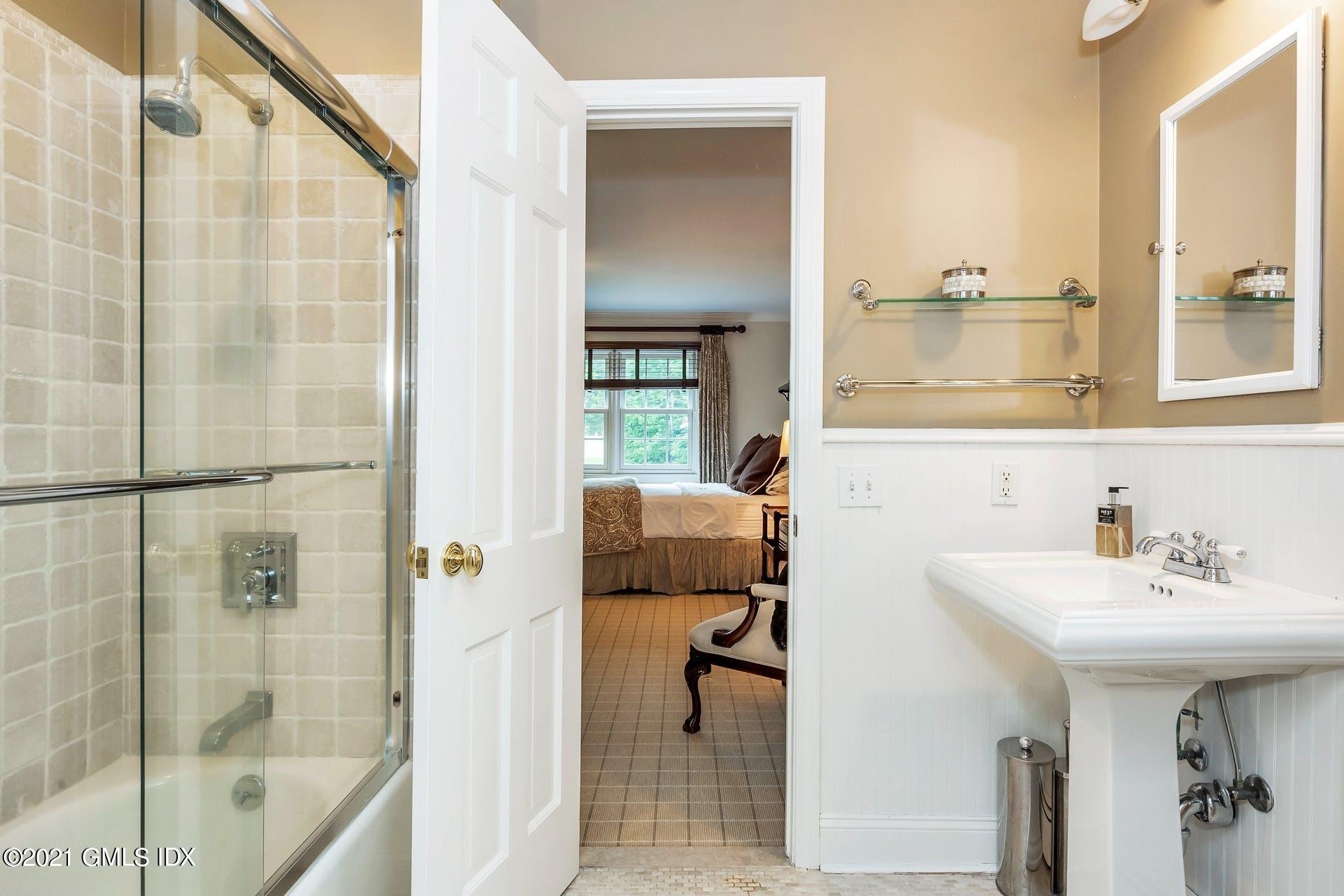 425 Stanwich Road Greenwich, CT 06830 - Photo 20 of 36 a bathroom with a sink and a mirror