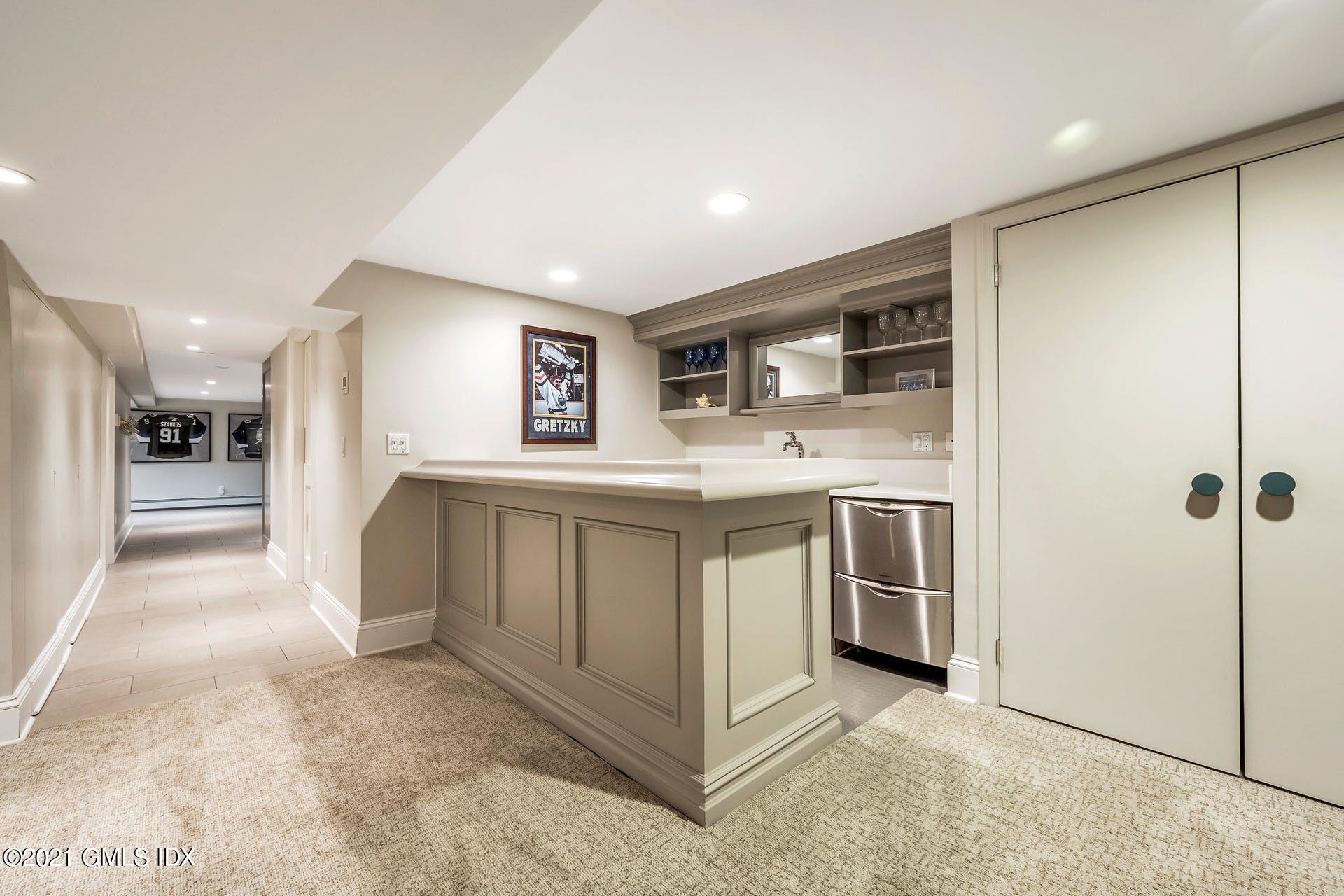 425 Stanwich Road Greenwich, CT 06830 - Photo 23 of 36 a kitchen with a sink stove and refrigerator
