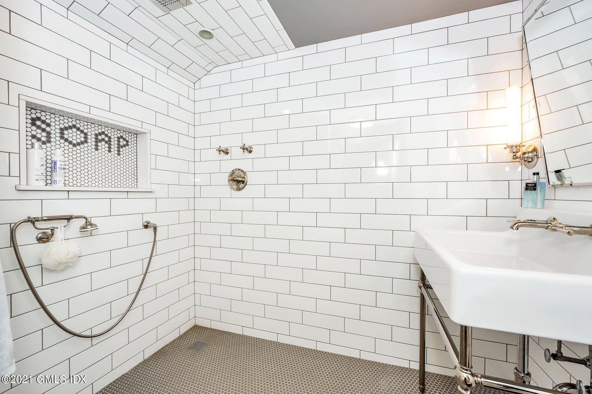 425 Stanwich Road Greenwich, CT 06830 - Photo 24 of 36 a bathroom with a bathtub and sink