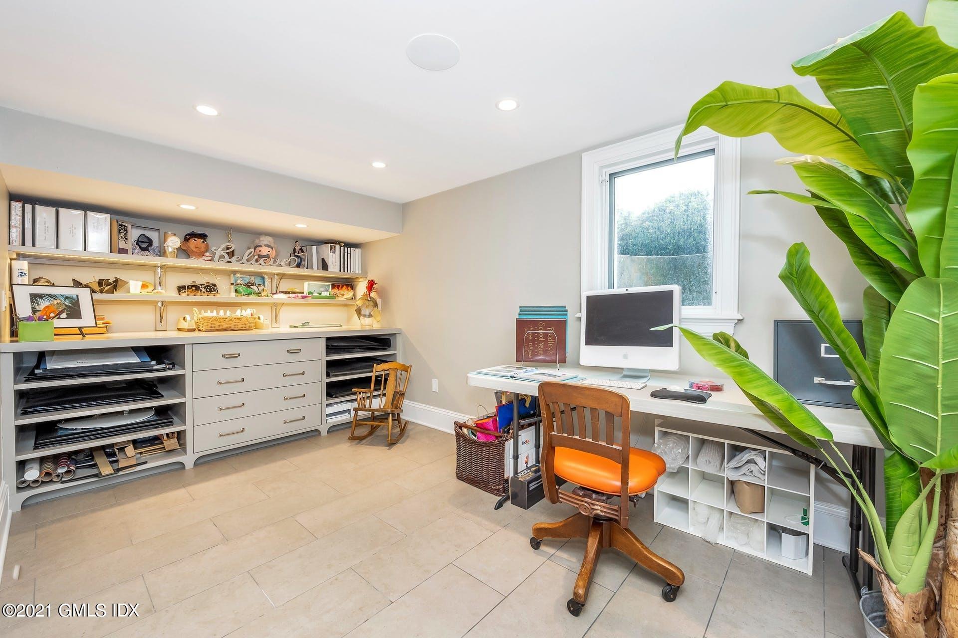 425 Stanwich Road Greenwich, CT 06830 - Photo 26 of 36 a workspace with furniture and book shelf