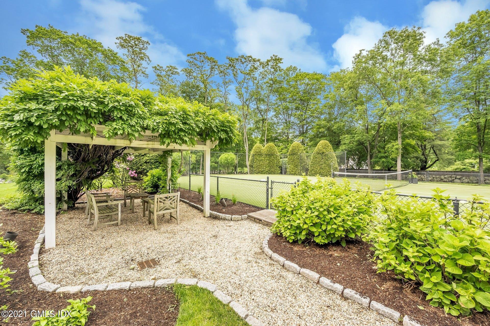 425 Stanwich Road Greenwich, CT 06830 - Photo 30 of 36 a garden view with a seating space