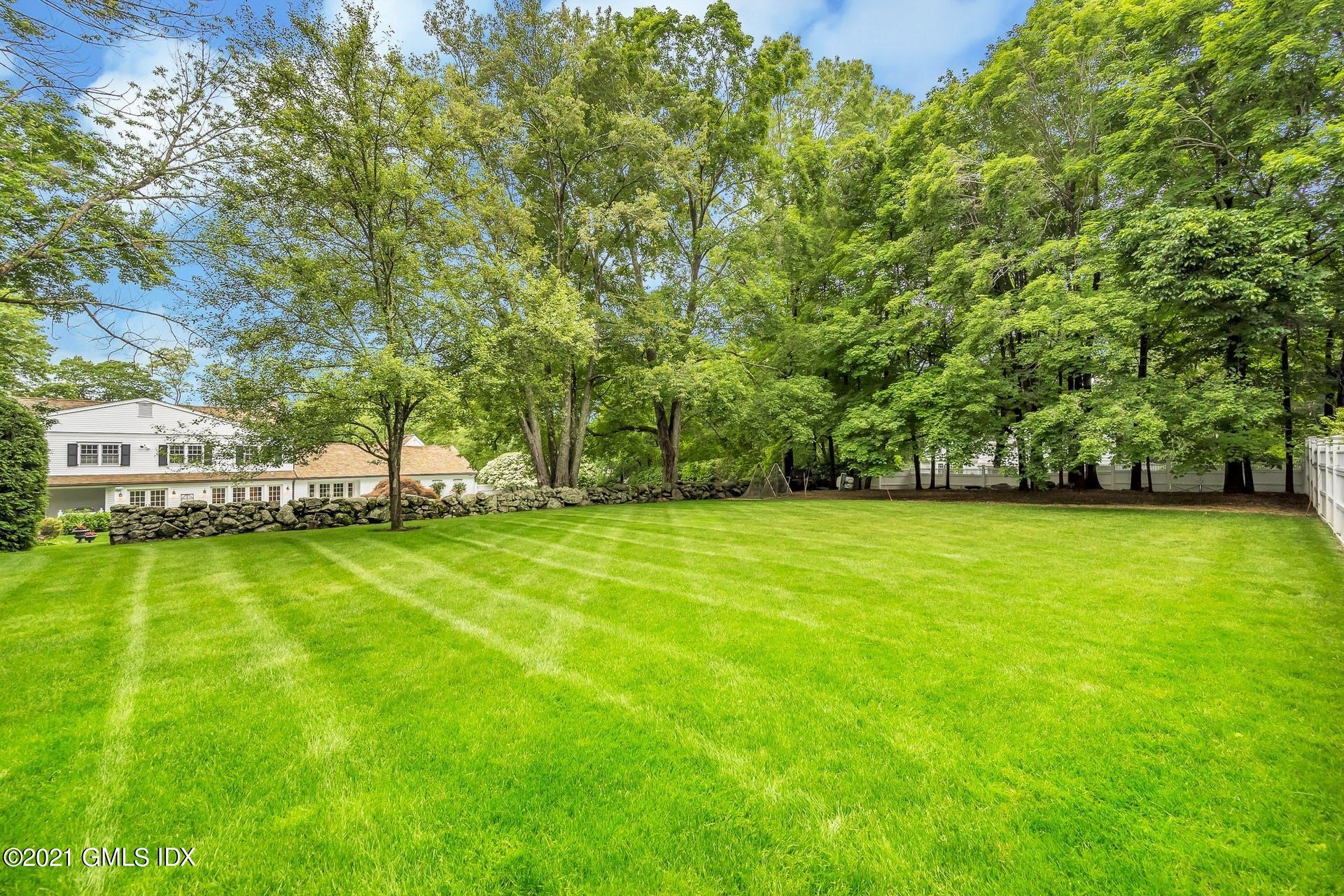 425 Stanwich Road Greenwich, CT 06830 - Photo 32 of 36 a view of a field of grass and trees