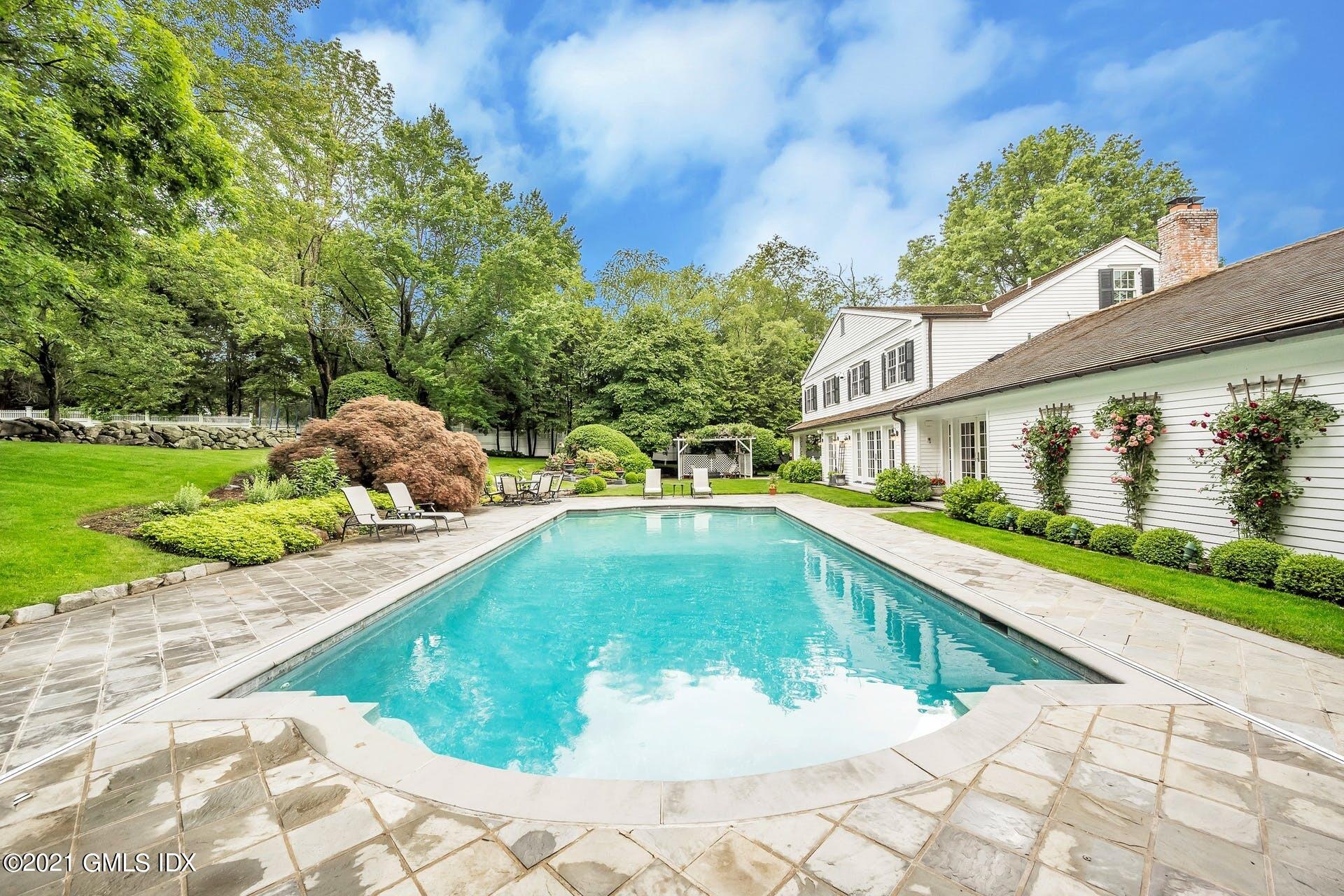 425 Stanwich Road Greenwich, CT 06830 - Photo 35 of 36 a swimming pool with outdoor seating and garden