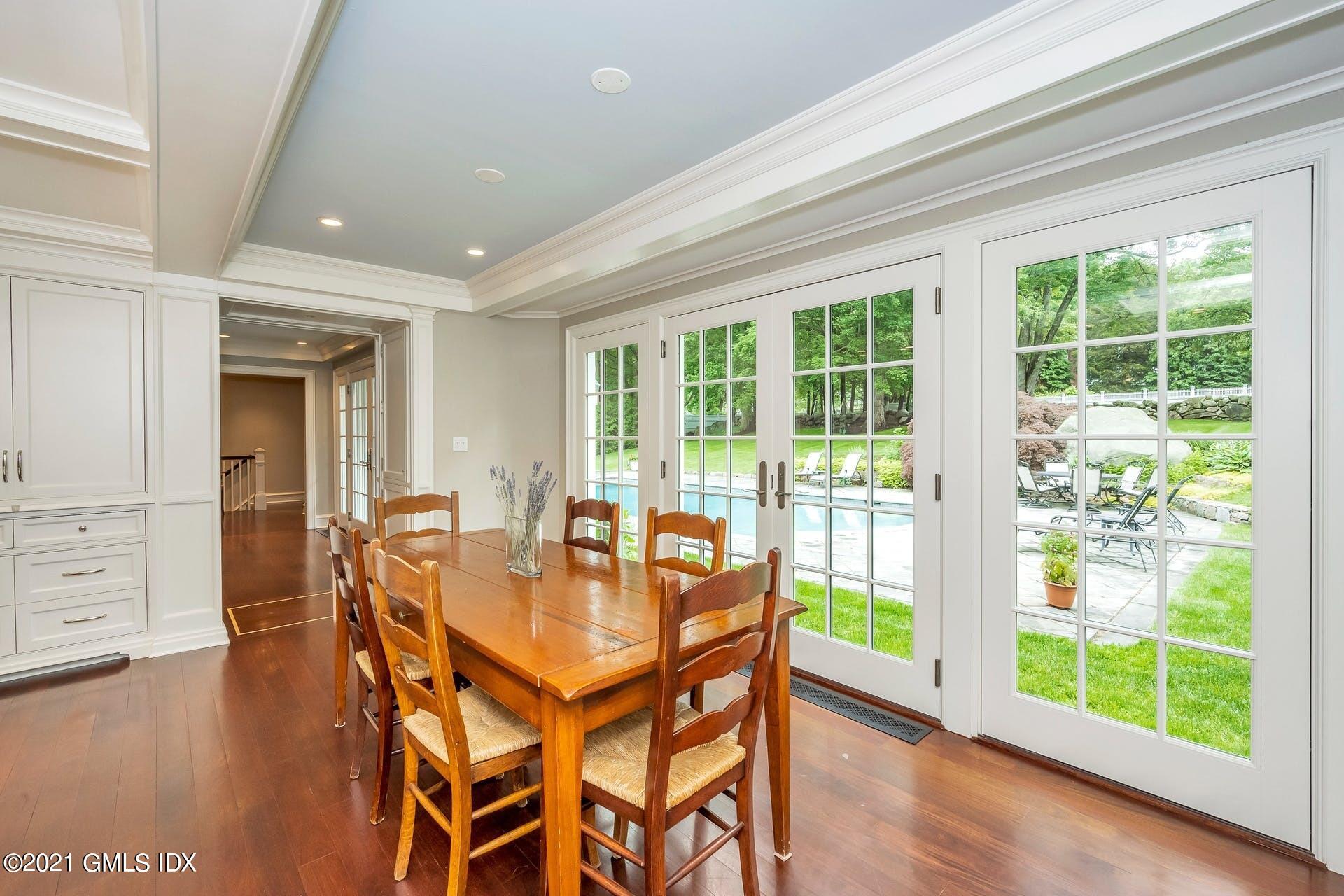 425 Stanwich Road Greenwich, CT 06830 - Photo 7 of 36 a dining room with furniture and wooden floor